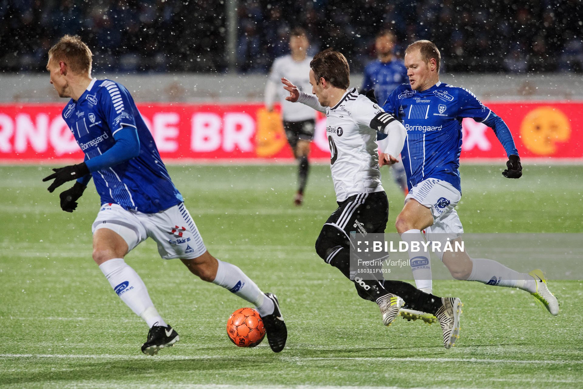 Mike Jensen of Rosenborg gets tackled by Matti Lund Nielsen