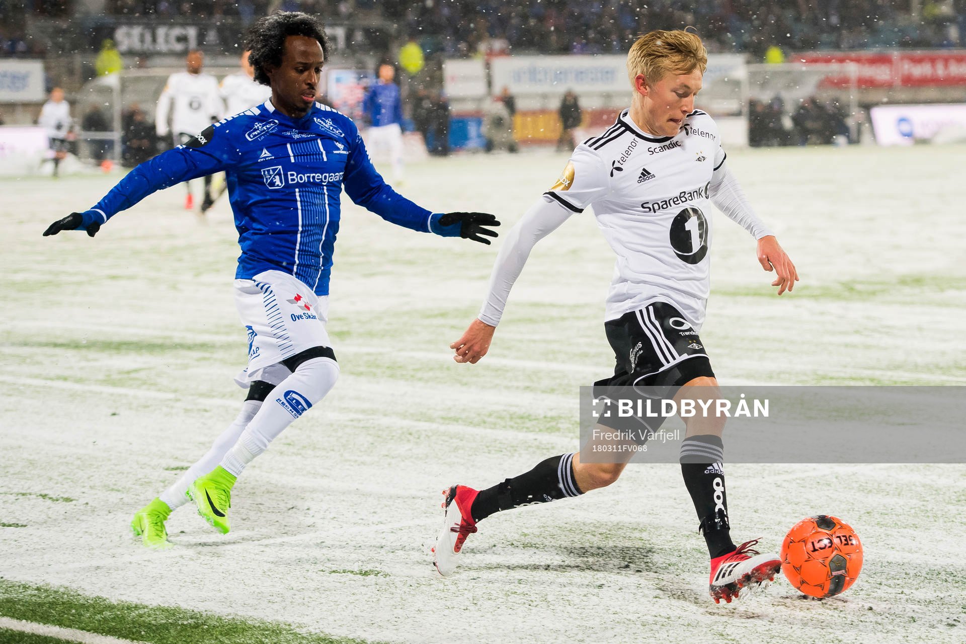 Amin Askar  of Sarpsborg 08 and Birger Meling of Rosenborg