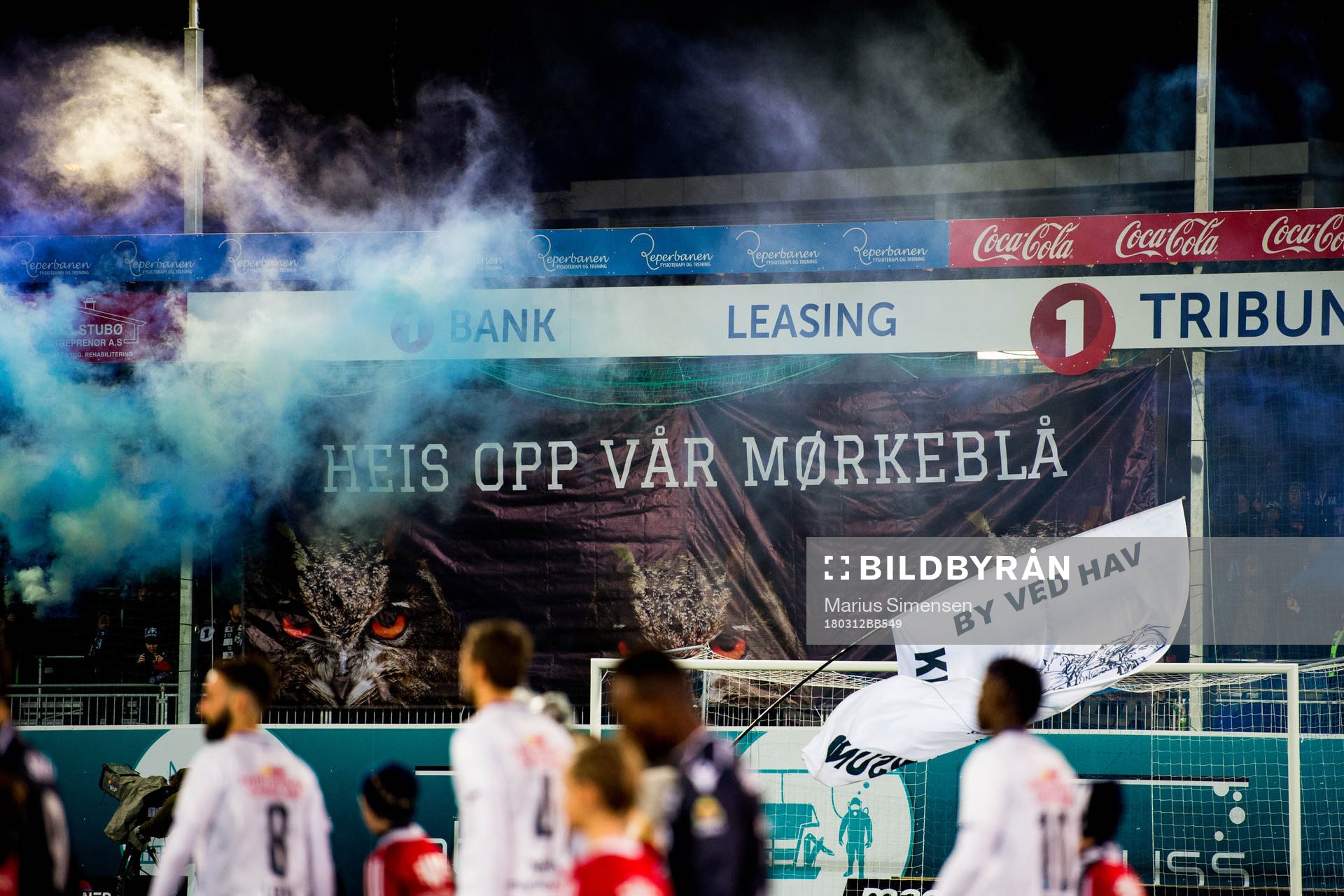 Smoke and banners while the players enter the field