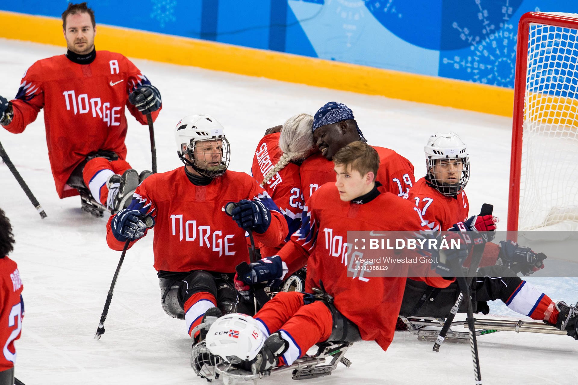Lena Schrøder and goaltender Kissinger Deng of Norway