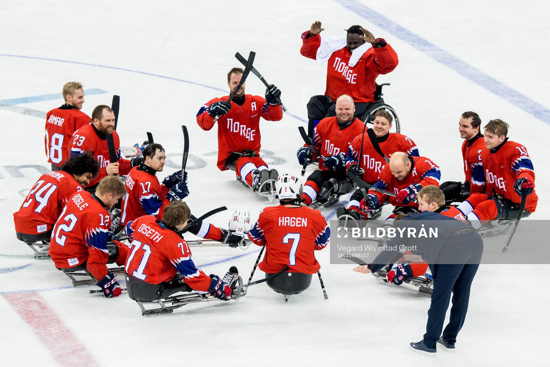 Eskil Hagen of Norway is applauded by teammates and head