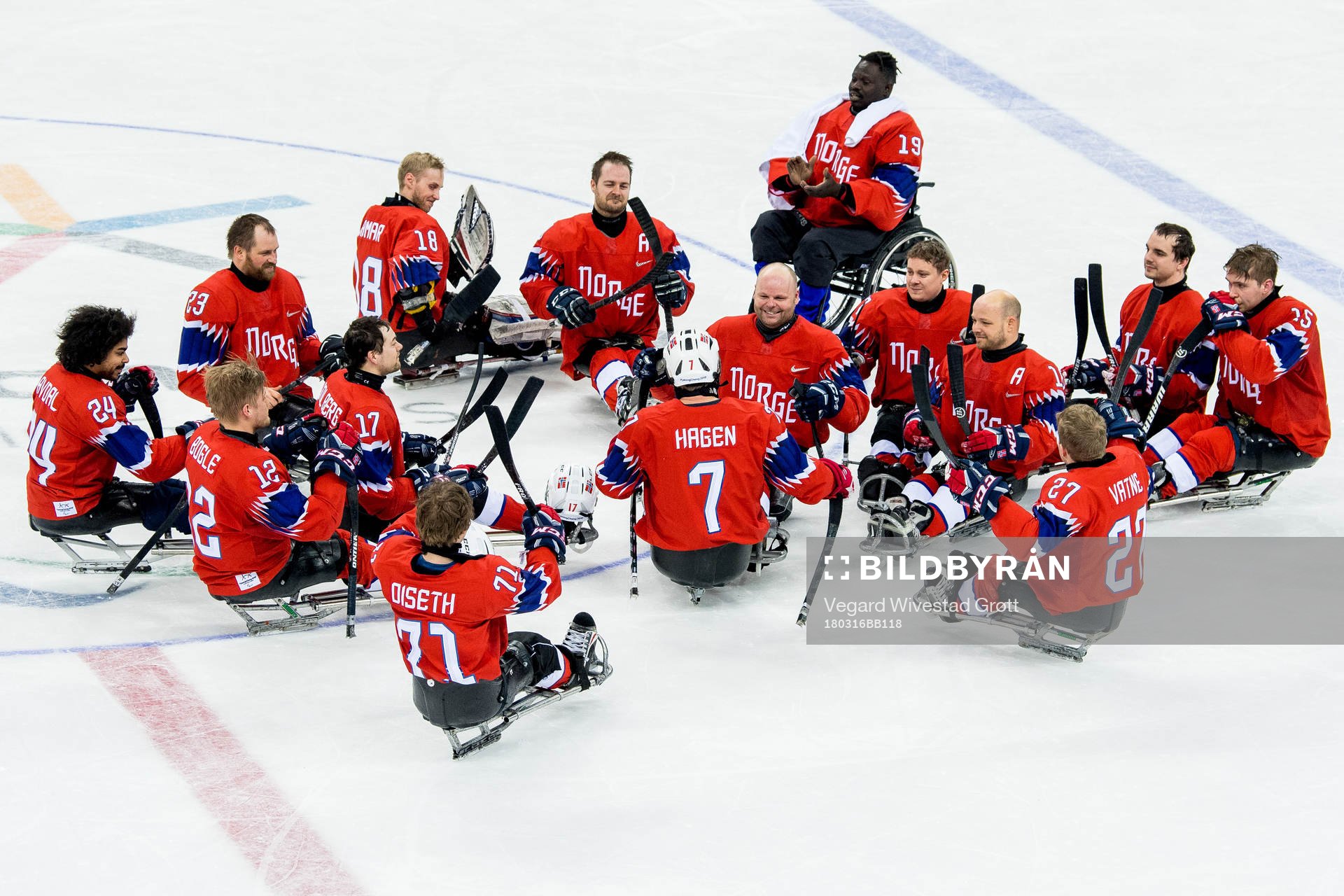 Eskil Hagen of Norway is applauded by teammates