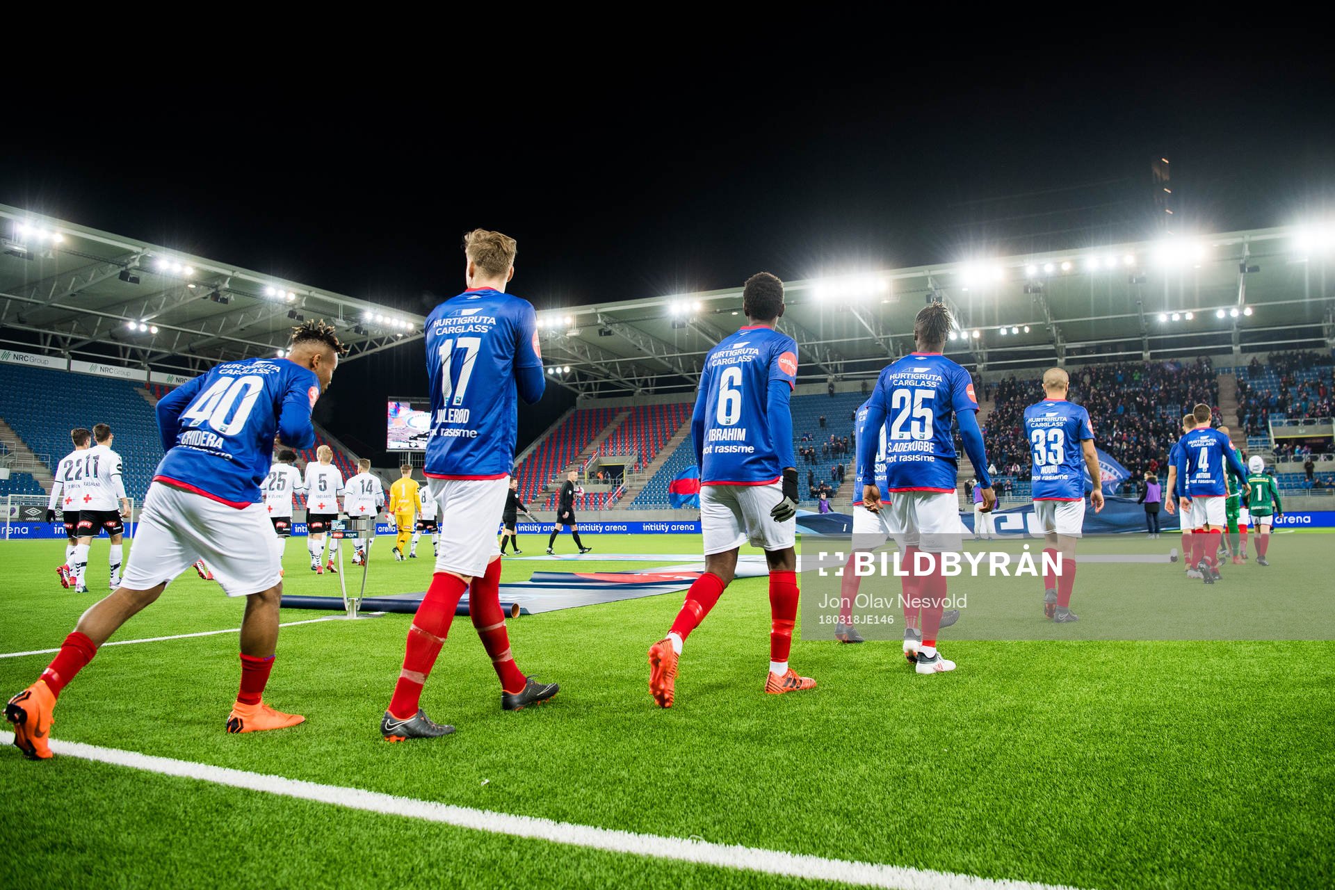 The Vålerenga players enter the pitch
