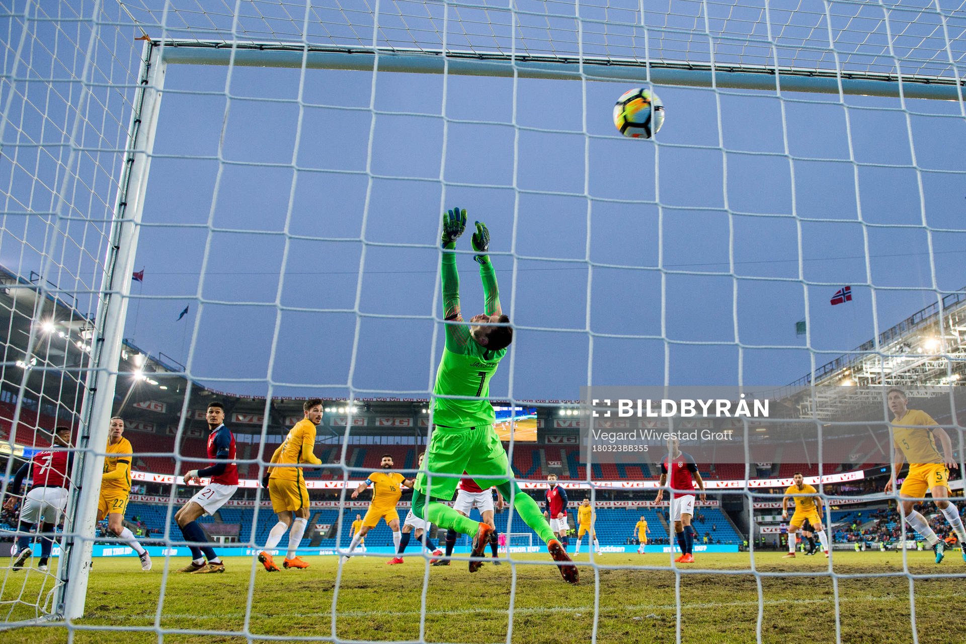 Jackson Irvine of Australia scores 0-1 behind goalkeeper