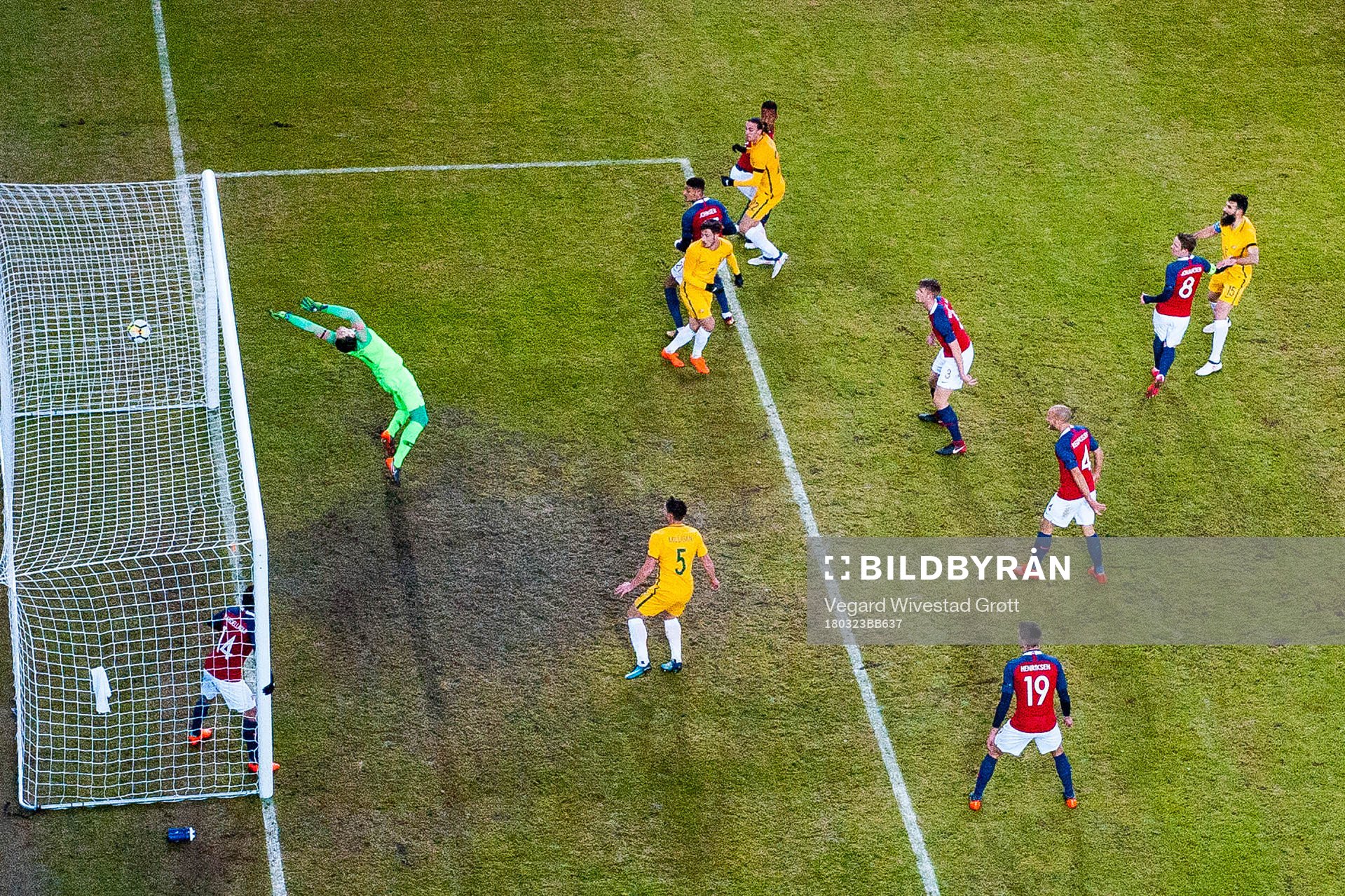 Jackson Irvine of Australia scores 0-1 behind goalkeeper