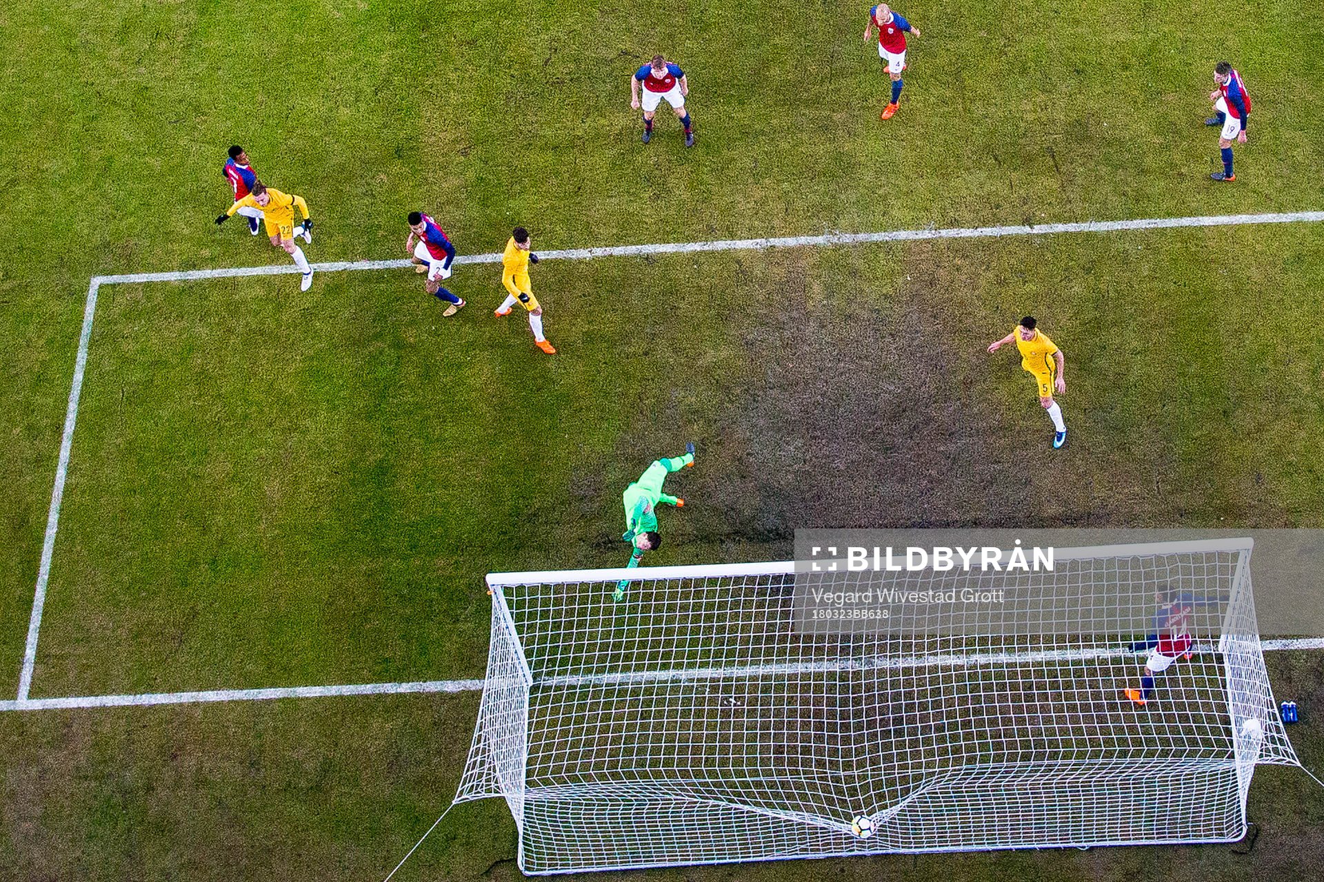 Jackson Irvine of Australia scores 0-1 behind goalkeeper
