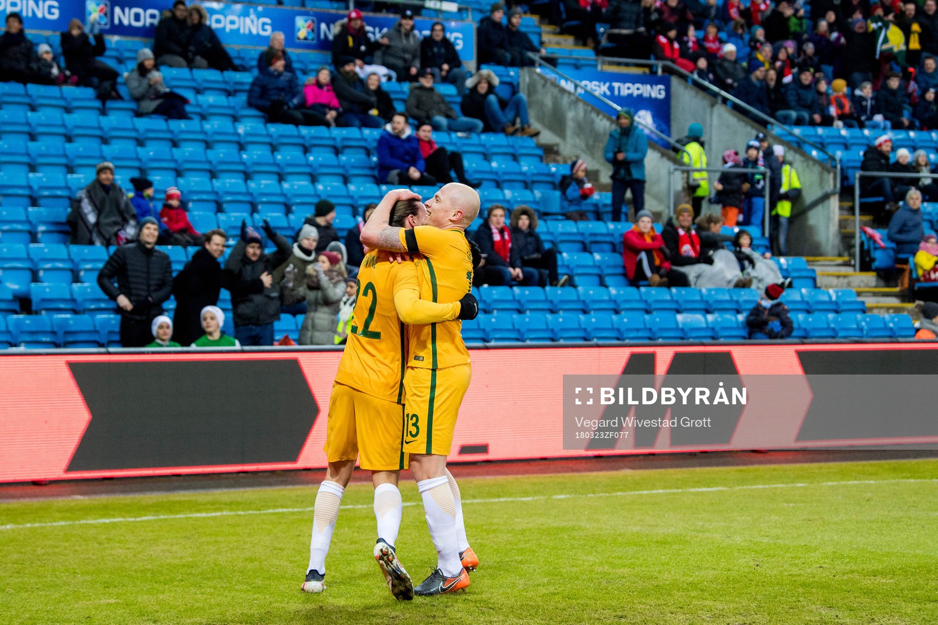 Jackson Irvine of Australia celebrates with teammate Aaron