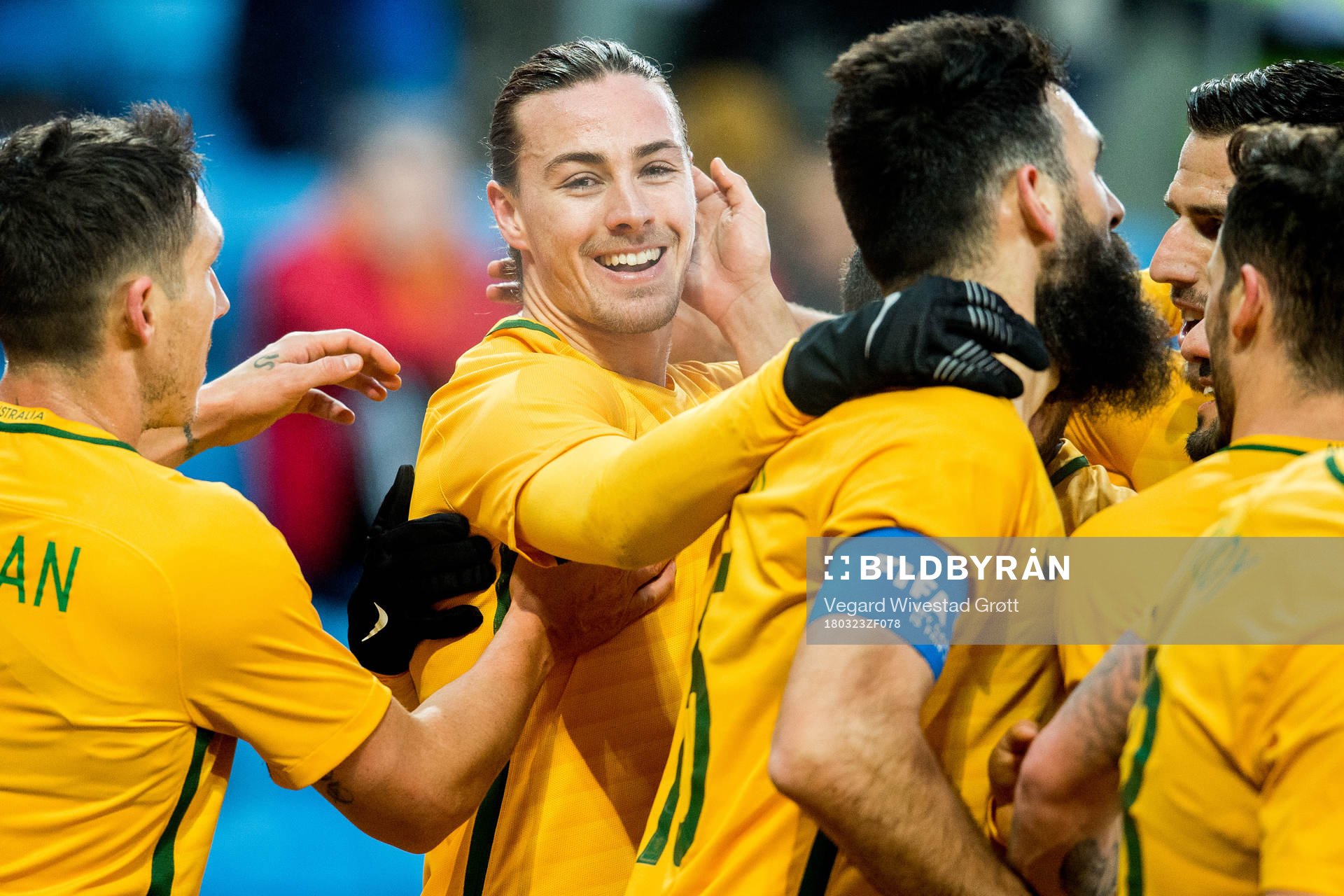 Jackson Irvine of Australia celebrates with teammates
