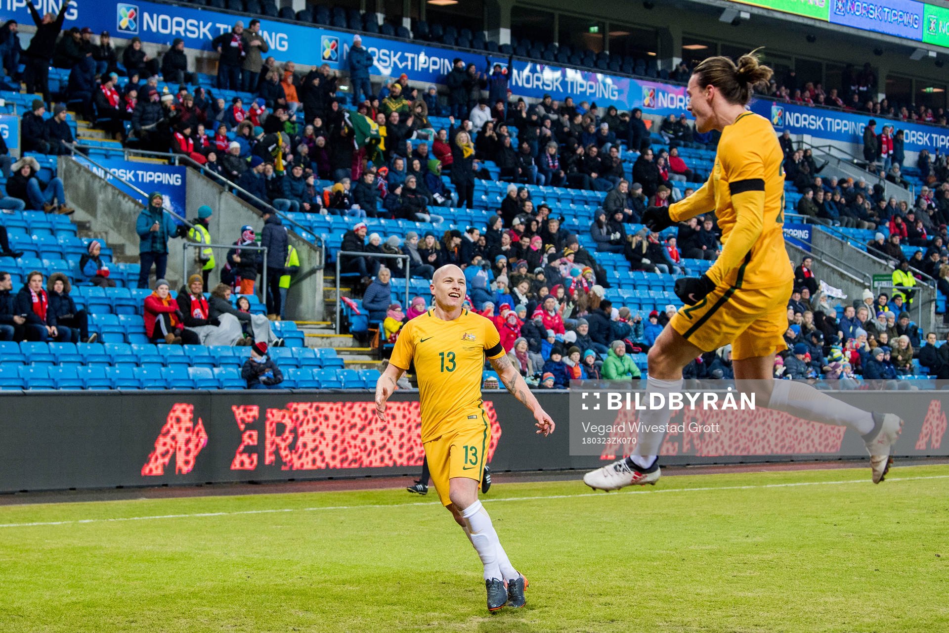 Jackson Irvine of Australia celebrates with teammate Aaron Mooy after scoring 0-1 during the international friendly football match between Norway and Australia on March 23, 2018 in Oslo.