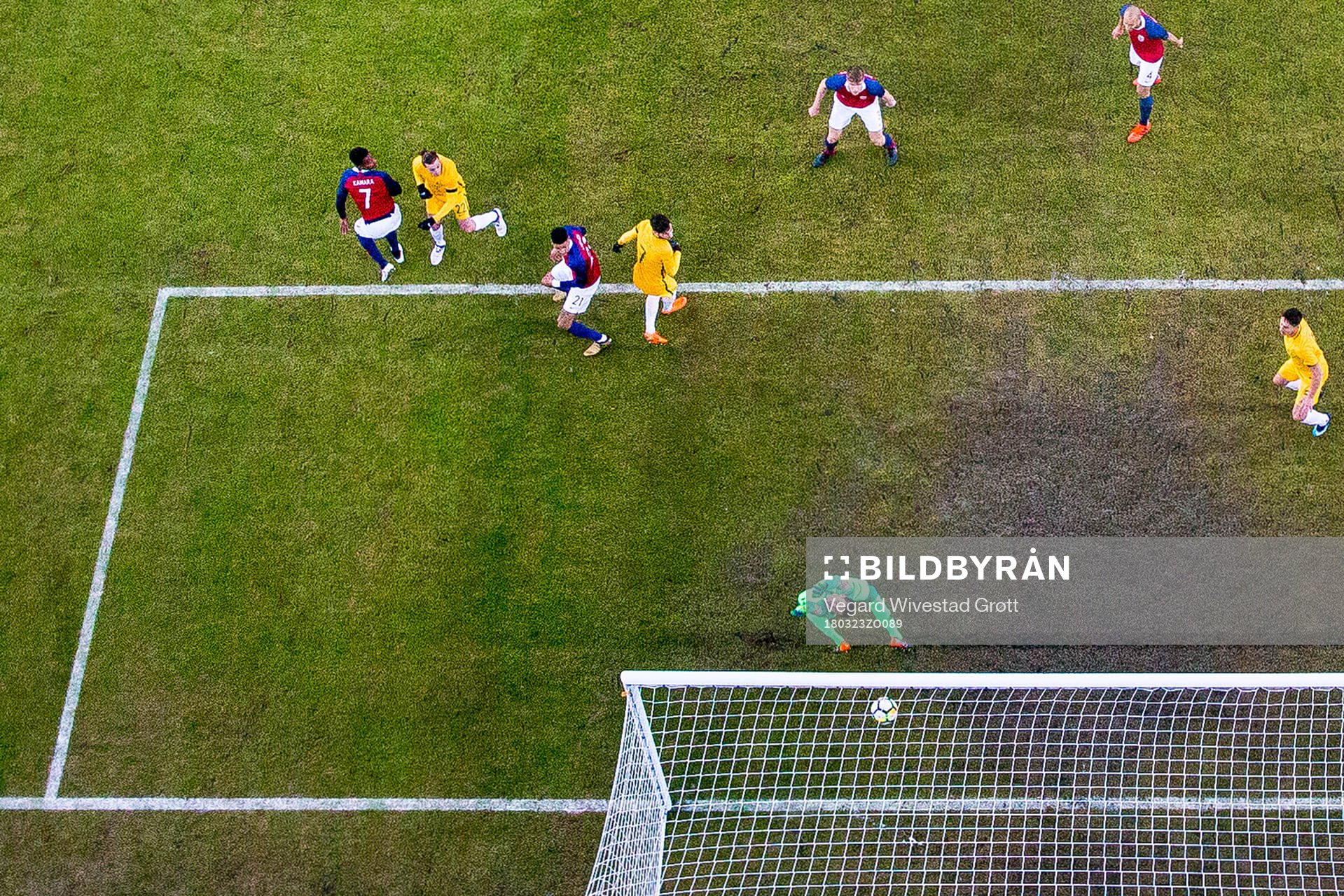 Jackson Irvine of Australia scores 0-1 behind goalkeeper