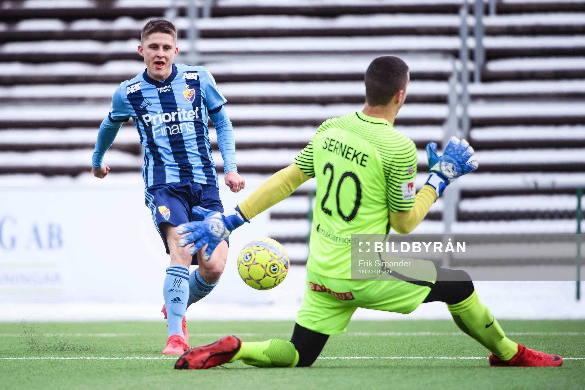 Djurgårdens Johan Andersson skjuter ett skott som räddas av Brommapojkarnas målvakt Nikola Petric under en träningsmatch i fotboll mellan Brommapojkarna och Djurgården den 24 mars 2018 i Stockholm.