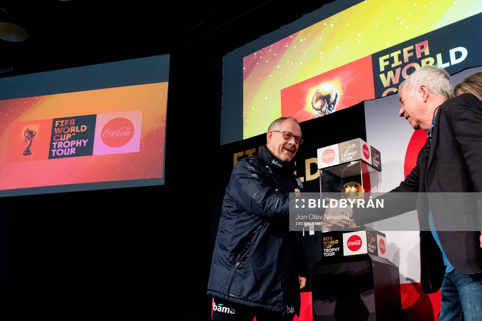 Lars Lagerbäck, head coach of Norway, and Egil Drillo Olsen, former head coach of Norway, in front of the World Cup Trophy during the FIFA World Cup Trophy Tour on March 24, 2018 in Oslo.
