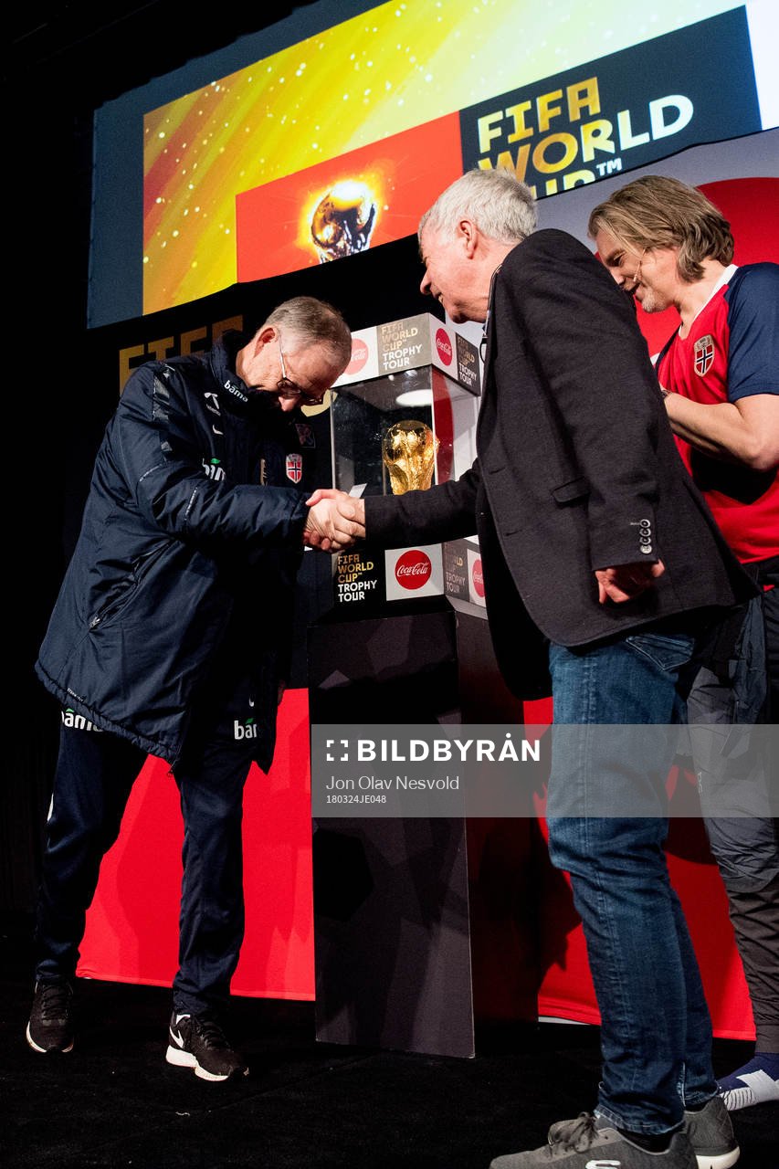 Lars Lagerbäck, head coach of Norway, and Egil Drillo Olsen, former head coach of Norway, in front of the World Cup Trophy during the FIFA World Cup Trophy Tour on March 24, 2018 in Oslo.