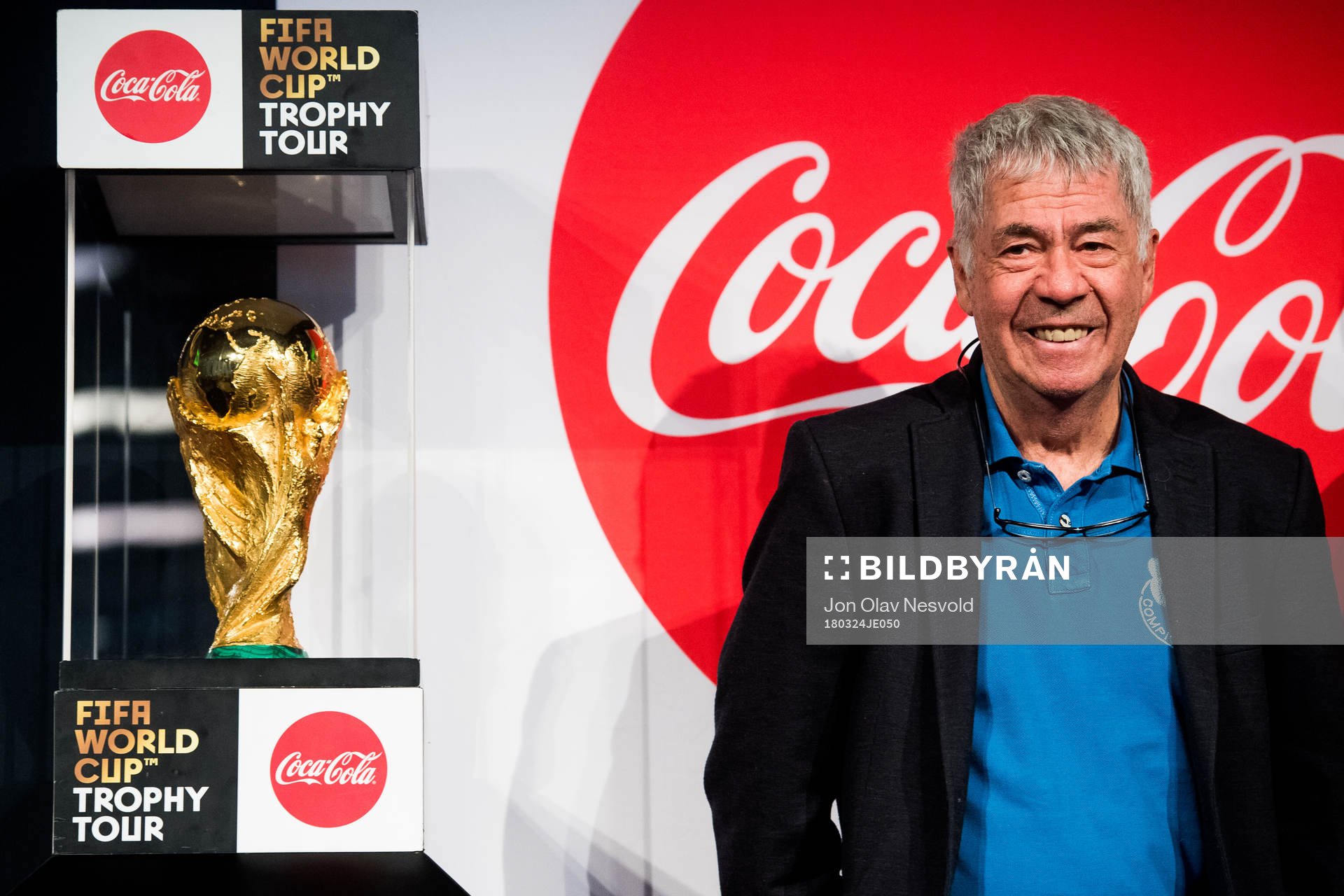 Egil Drillo Olsen, former head coach of Norway, stands beside the World Cup Trophy during the FIFA World Cup Trophy Tour on March 24, 2018 in Oslo.