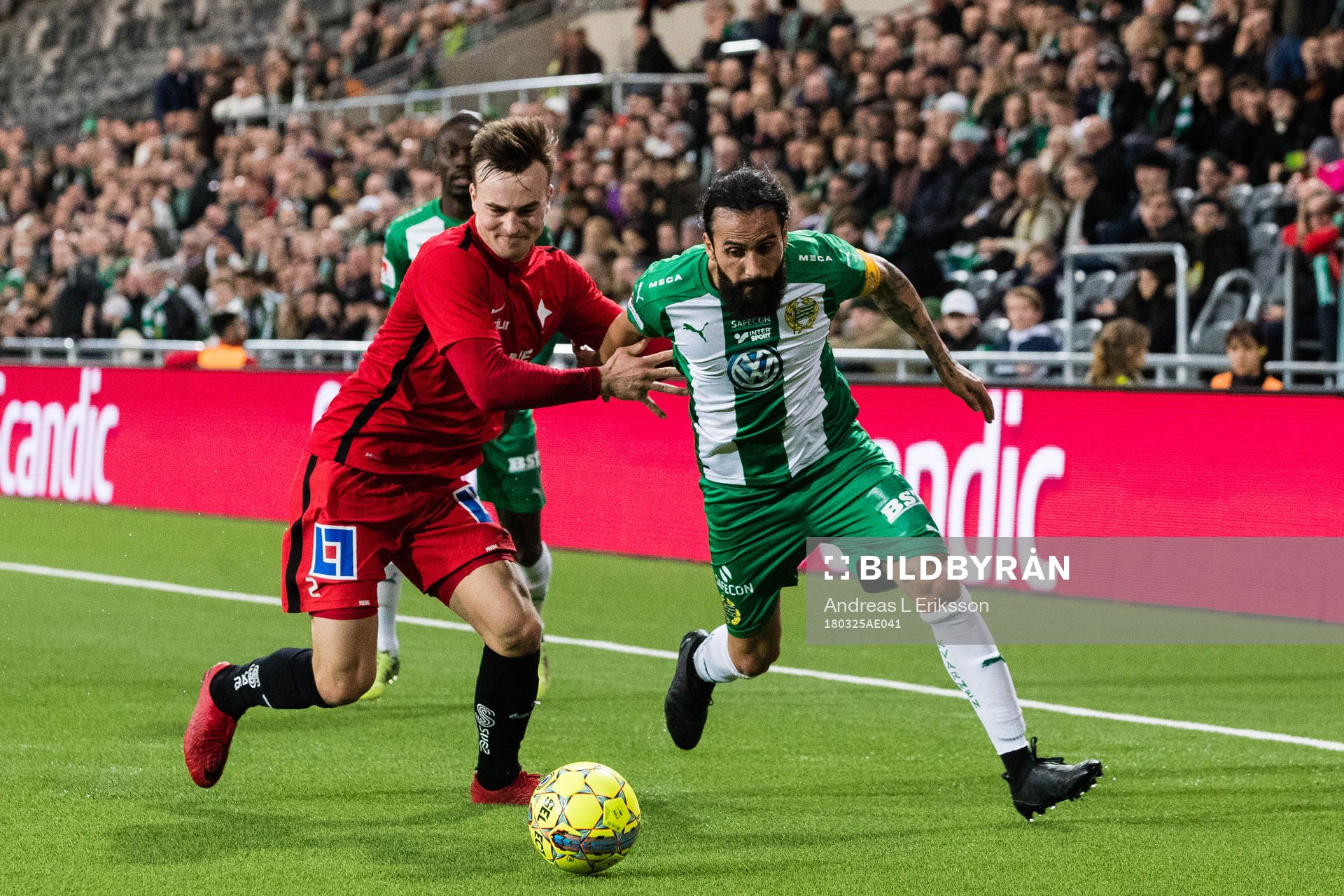 Norrköpings Henrik Castegren i kamp om bollen med Hammarbys Erkan Zengin under en träningsmatch i fotboll mellan Hammarby och Norrköping den 25 mars 2018 i Stockholm.
