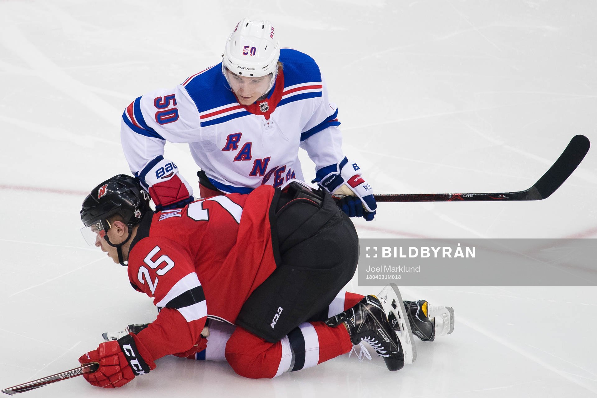 Devils Mirco Mueller och Rangers Lias Andersson