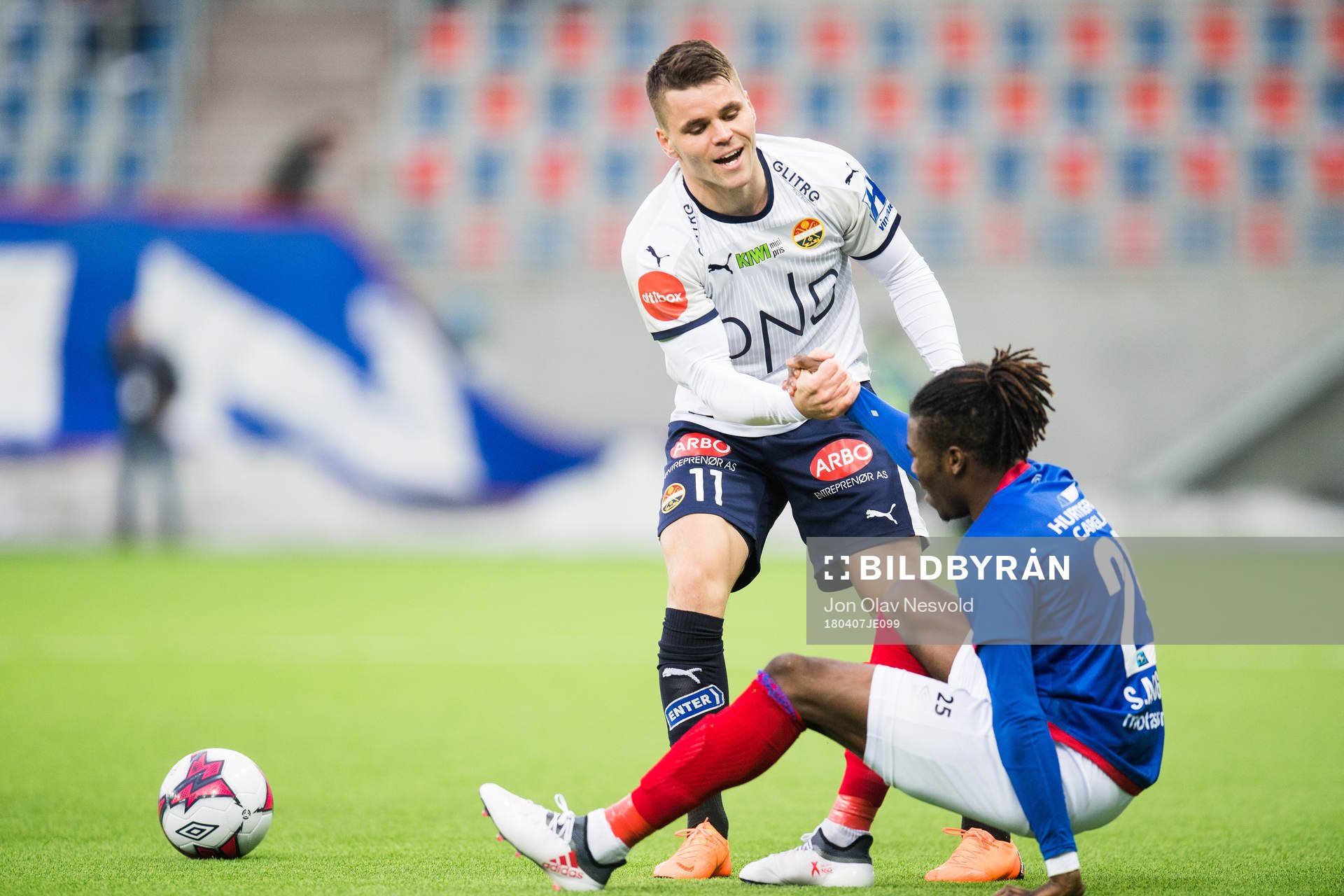 Kristoffer Tokstad of Strømsgodset and Samuel Adekugbe of