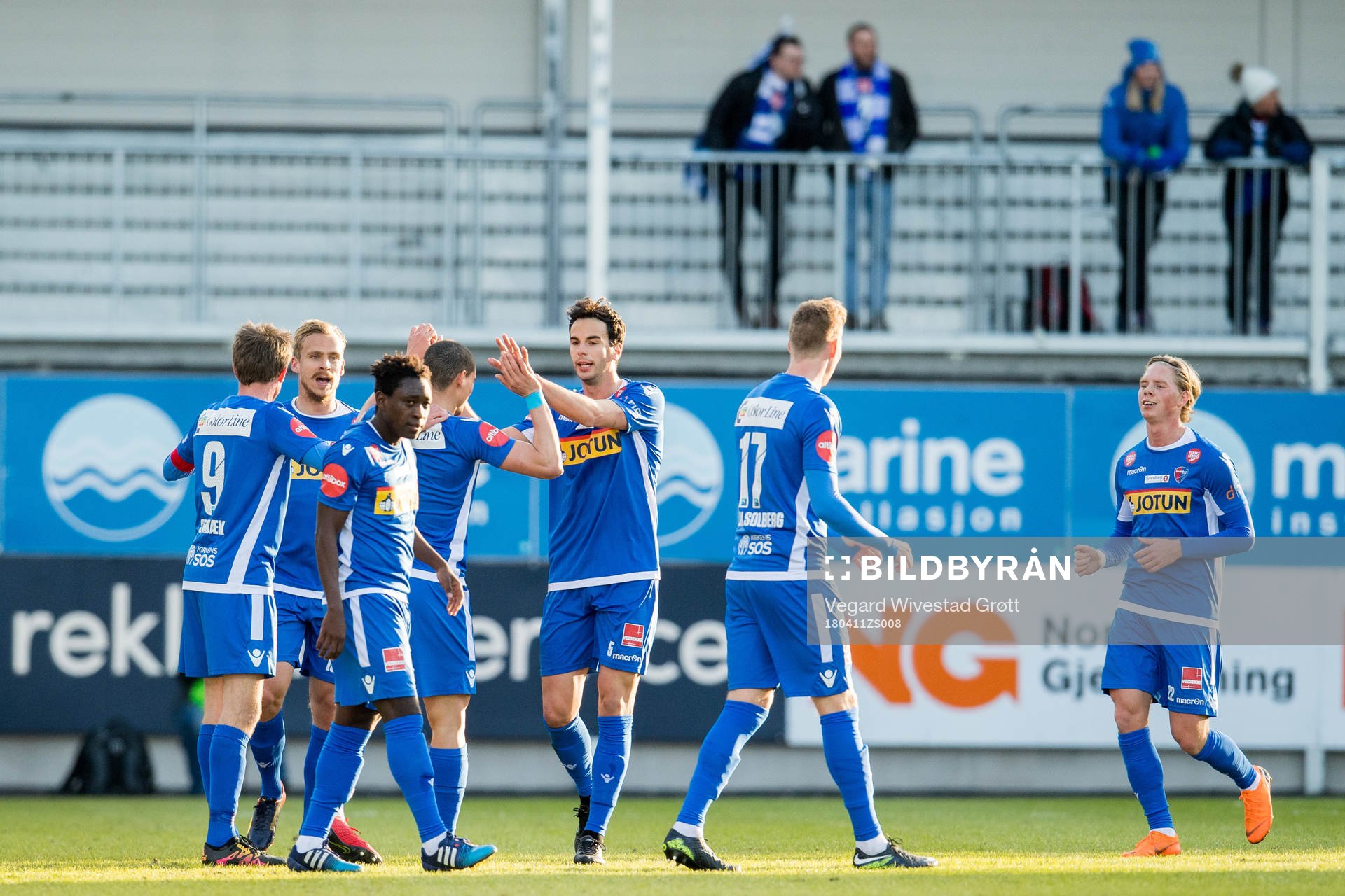 Mohamed Ofkir of Sandefjord celebrates with teammates after scoring 1-0 during the Eliteserien match between Sandefjord and Ranheim on April 11, 2018 in Sandefjord.