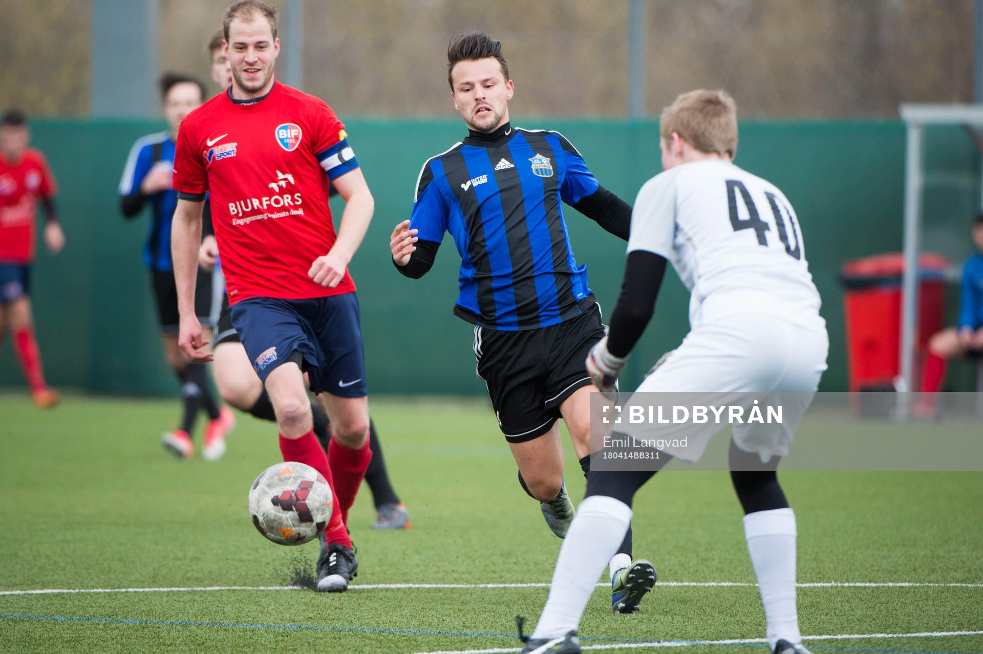 Bjärreds Tobias Jönsson, Lilla Torgs  Nikola Zivanovic och Bjärreds målvakt Hampus Lövkvist under fotbollsmatchen i division 4 sydvästra mellan Bjärred och Lilla Torg den 14 april 2018  i Bjärred.