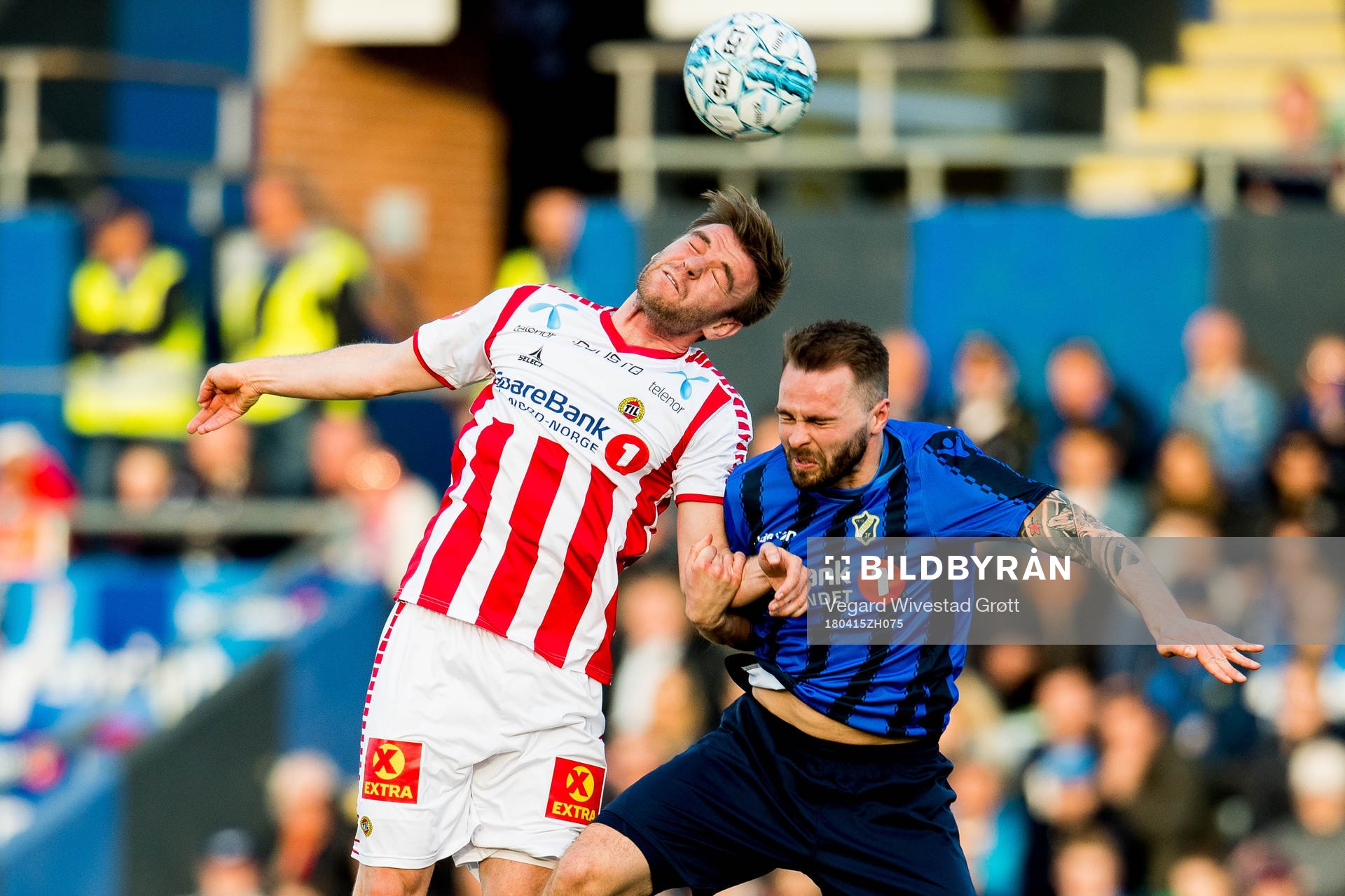 Slobodan Vuk of Tromsø and Vadim Demidov of Stabæk during the Eliteserien match between Stabæk and Tromsø on April 15, 2018 in Bekkestua.