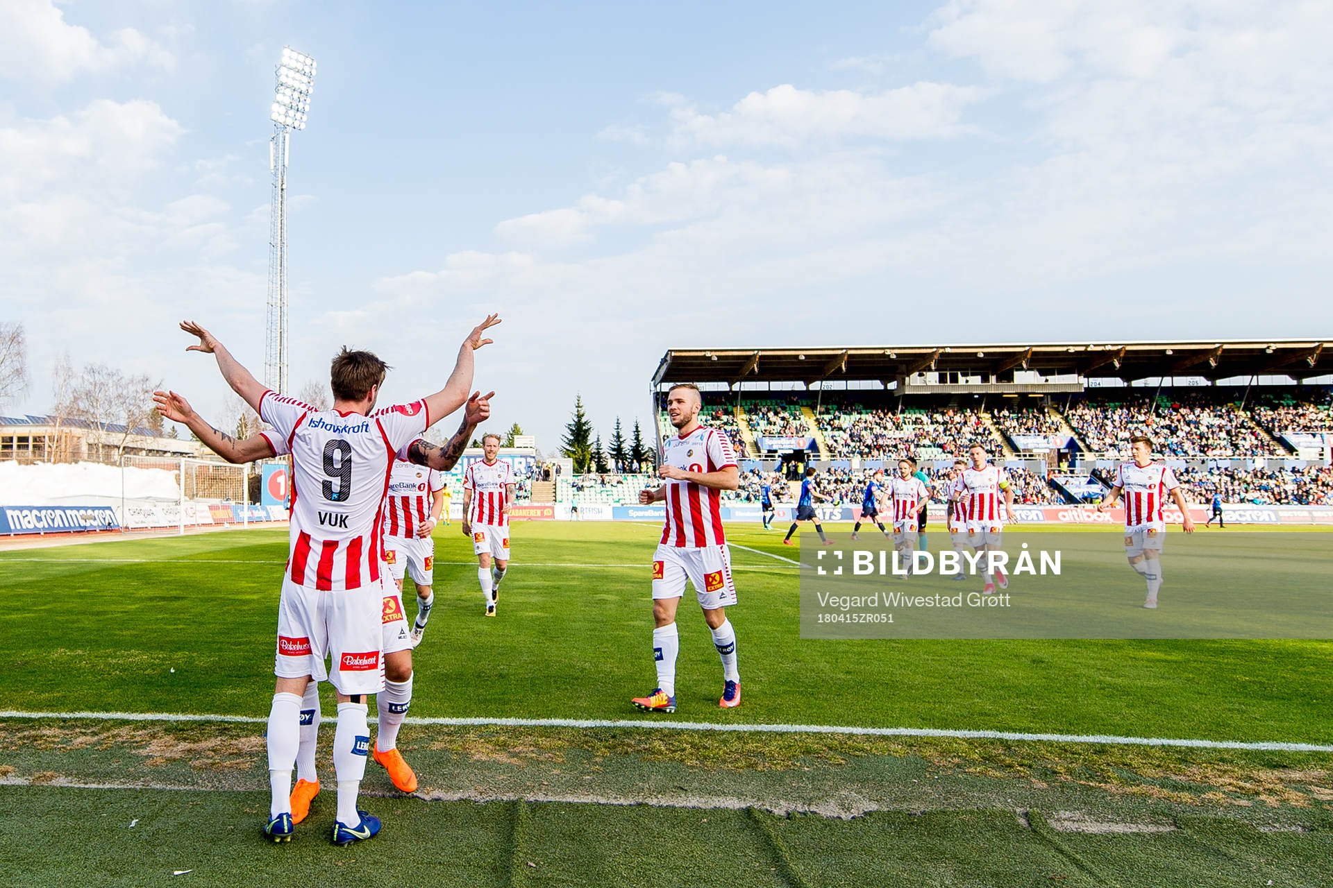Slobodan Vuk of Tromsø celebrates with teammates Runar