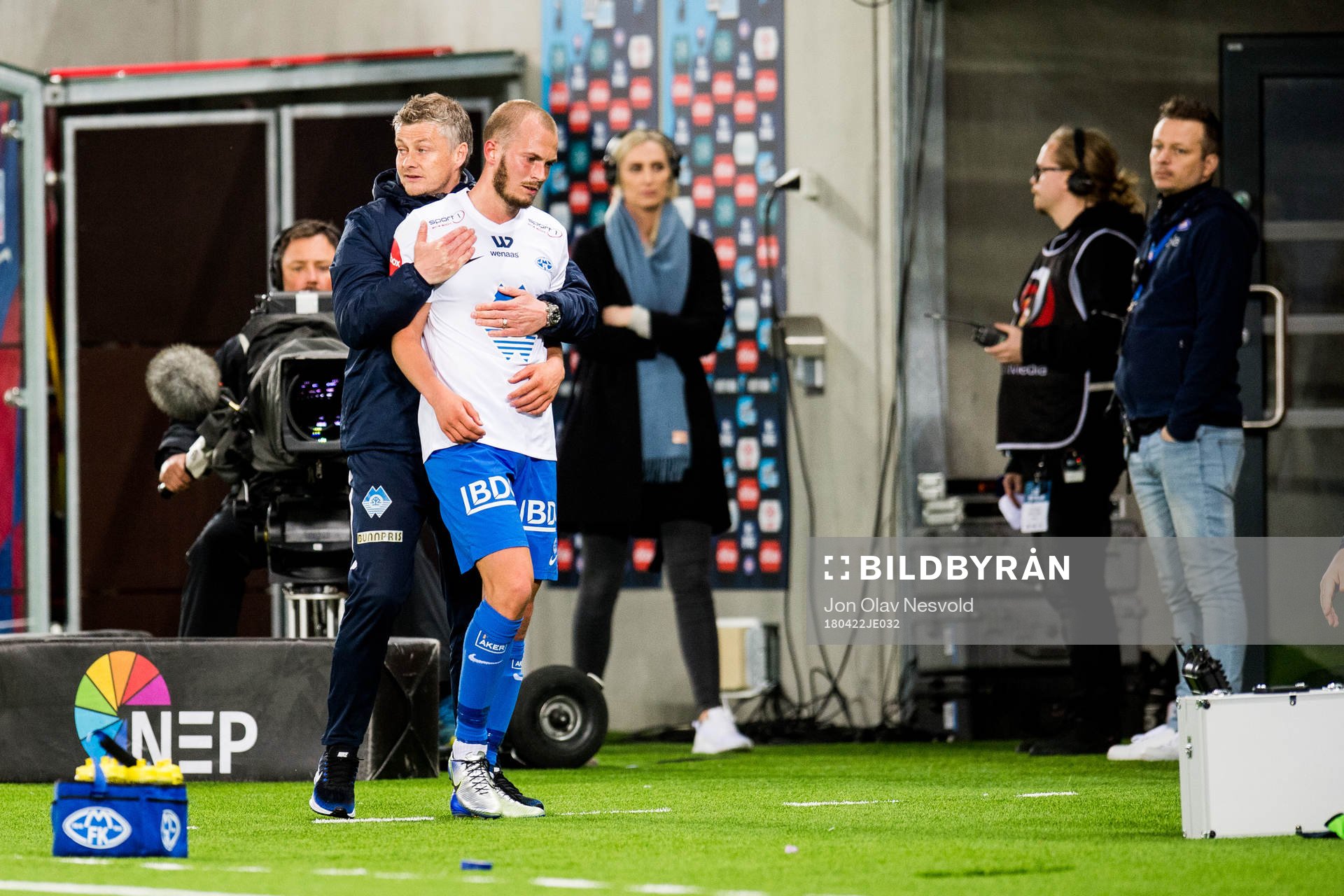 Ole Gunnar Solskjær, manager of Molde, holds Eirik Hestad