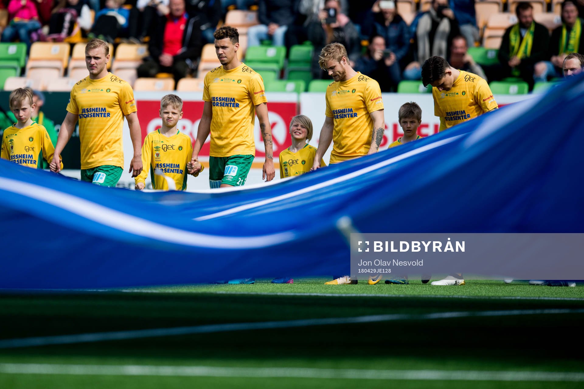 Emmanuel Troudart and the other players of Ull/Kisa enter the pitch ahead of the OBOS-ligaen match between Ull/Kisa and Viking on April 29, 2018 in Jessheim.