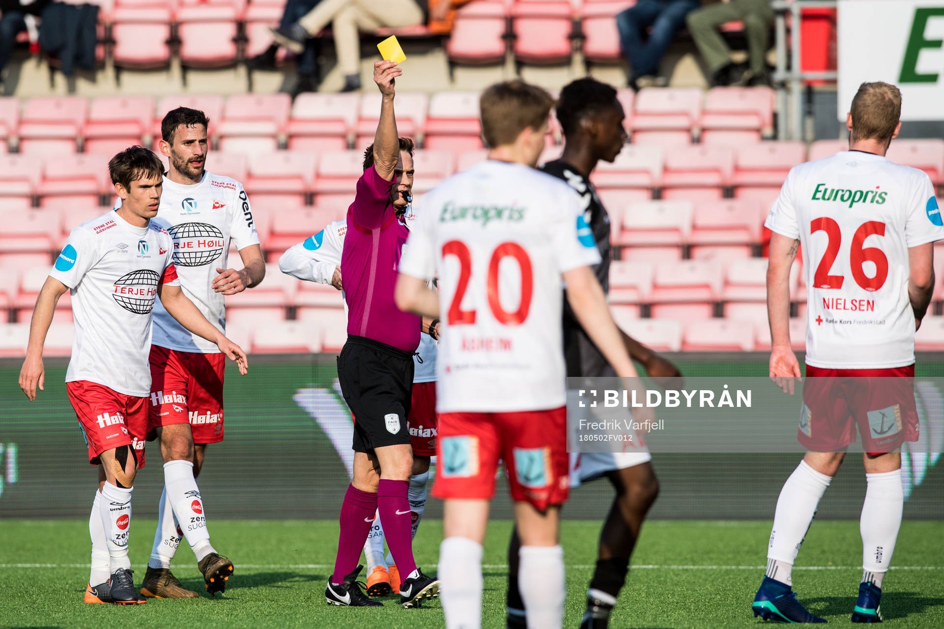 Mads Nielsen of Fredrikstad receives a yellow card of