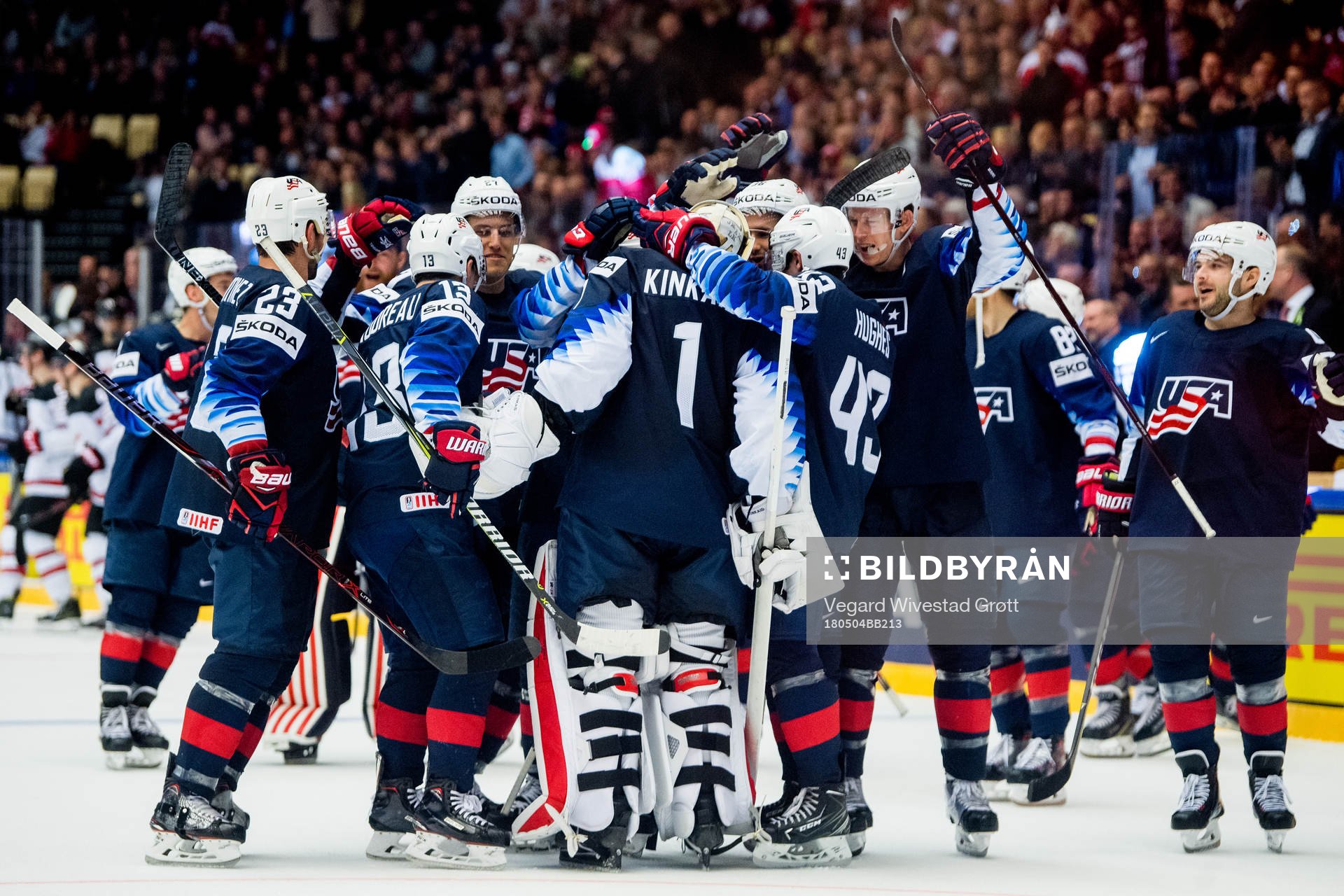 Players of USA celebrate with goaltender Keith Kinkaid