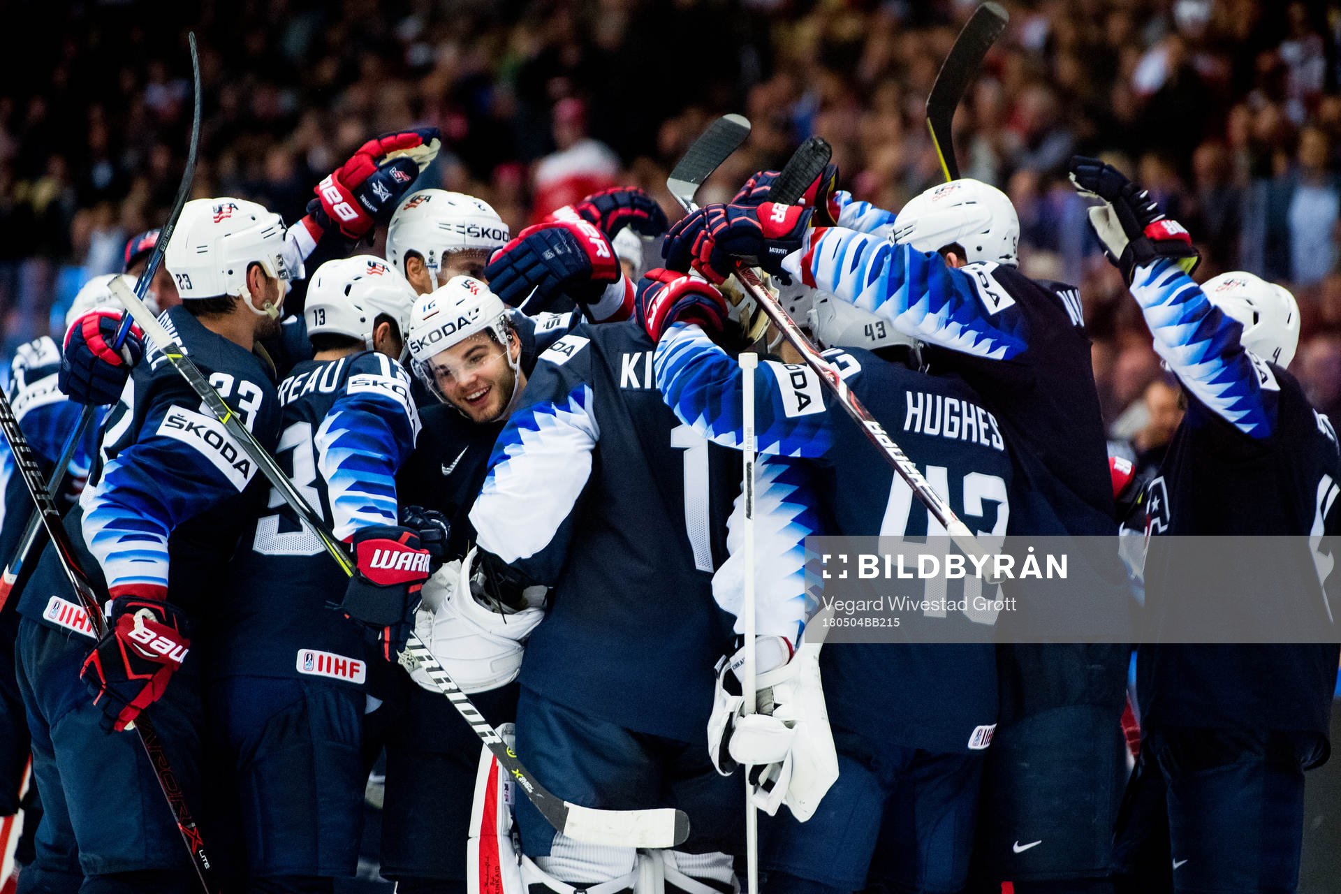 Alex DeBrincat of USA celebrates with teammates