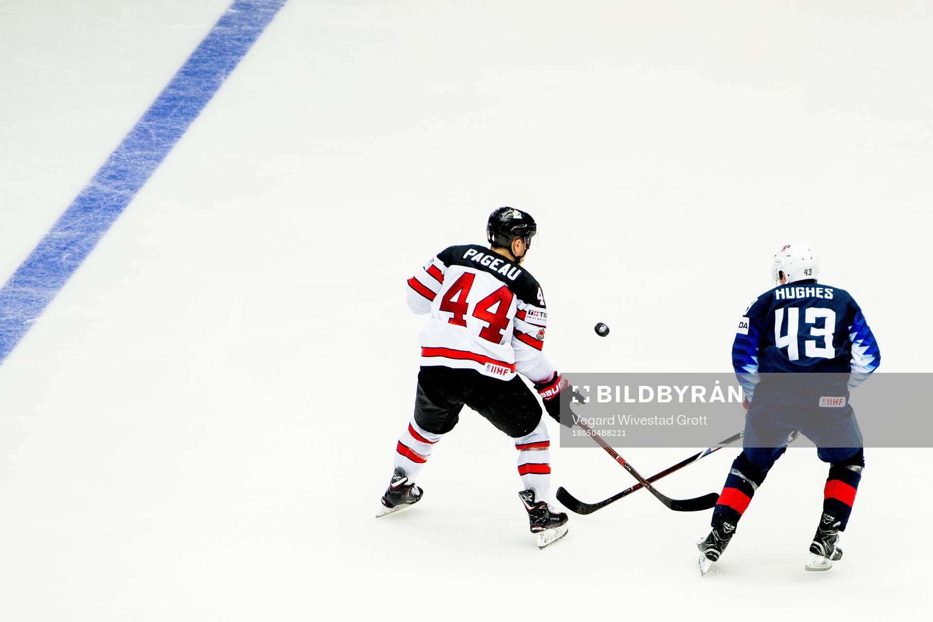 Jean-Gabriel Pageau of Canada and Quinn Hughes of USA