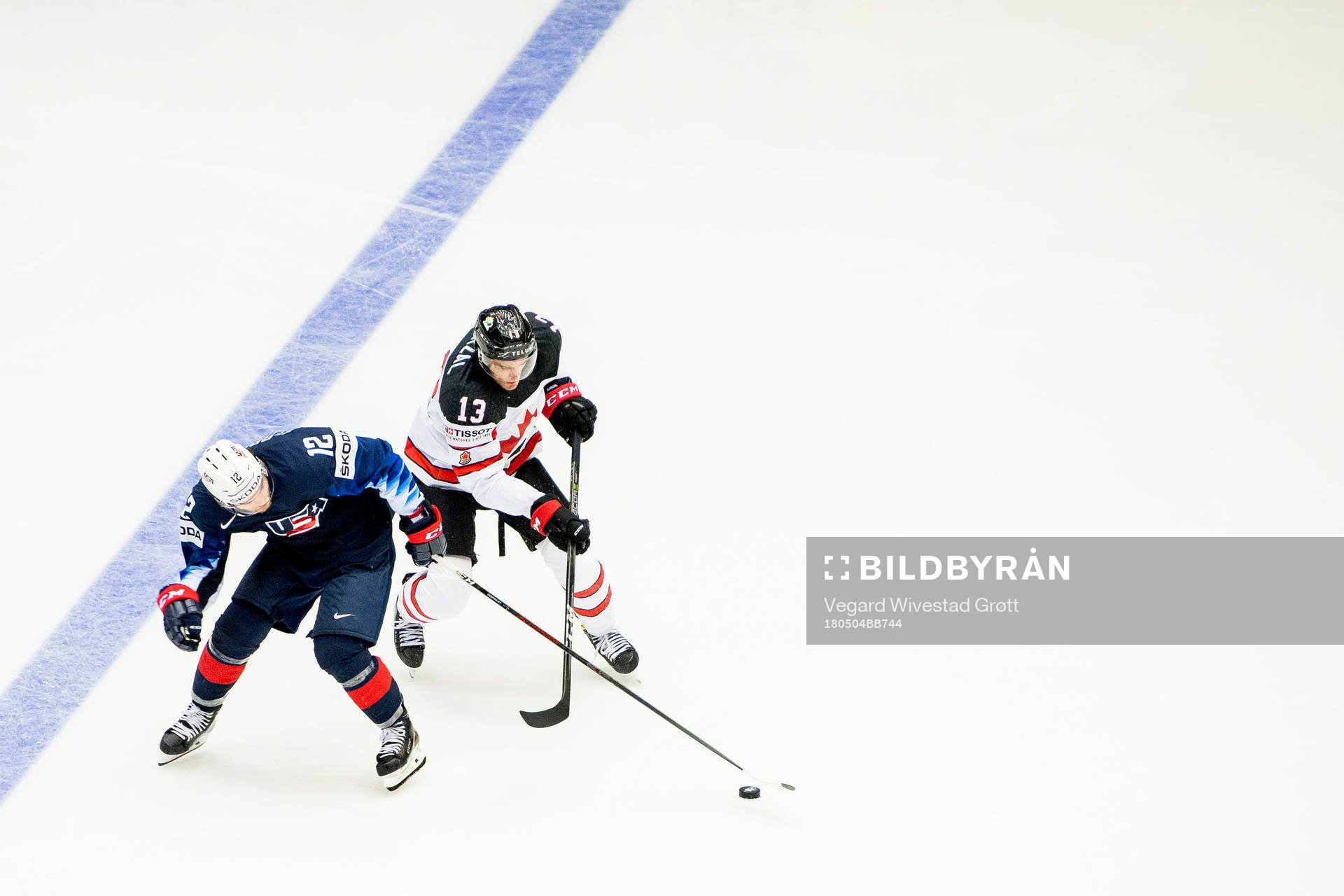 Alex DeBrincat of USA and Matt Barzal of Canada