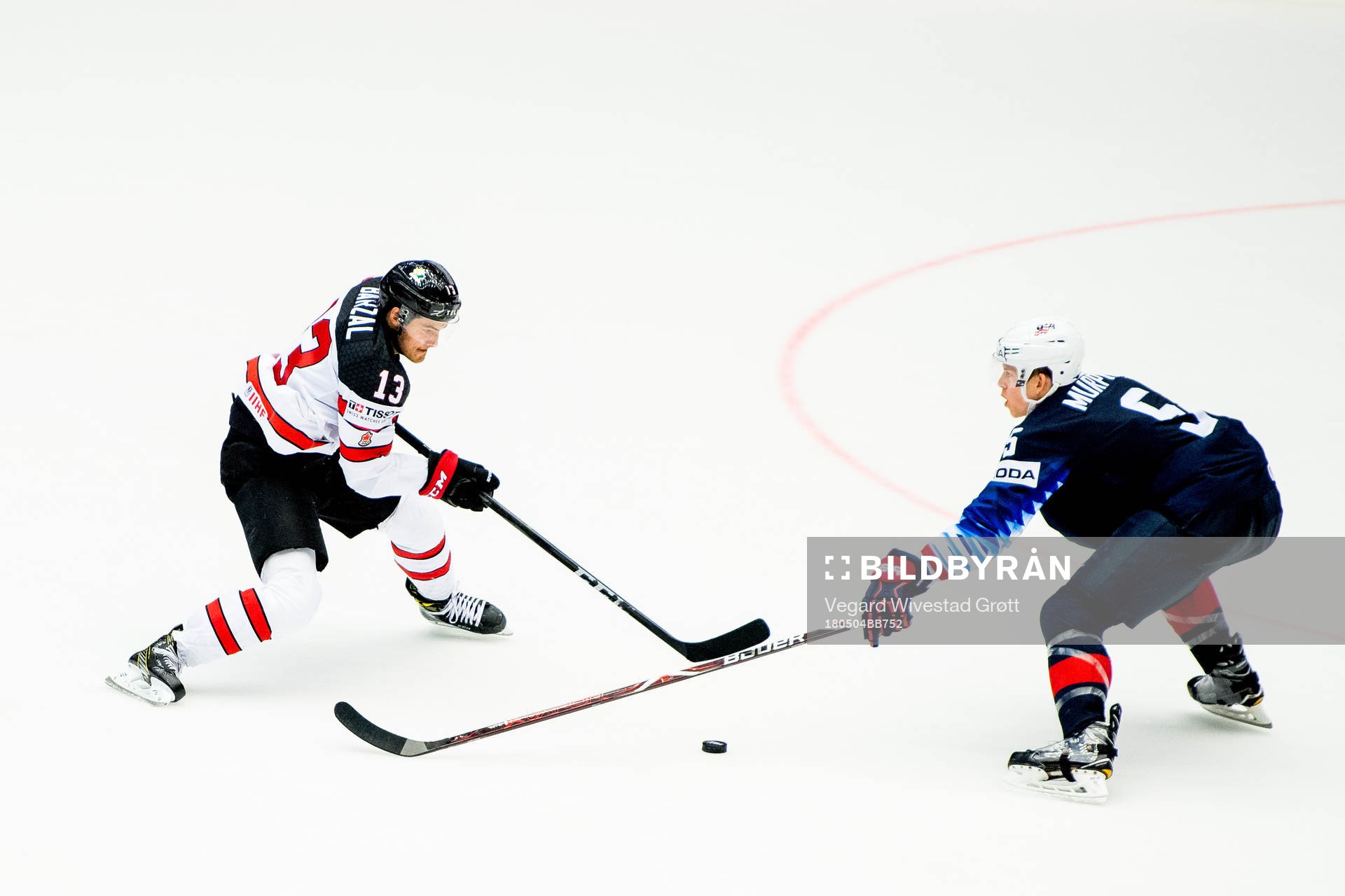 Matt Barzal of Canada and Connor Murphy of USA