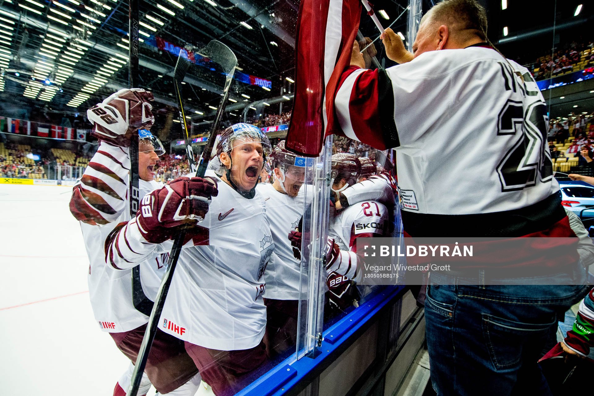 Rudolfs Balcers of Latvia celebrates with Andris Dzerins,