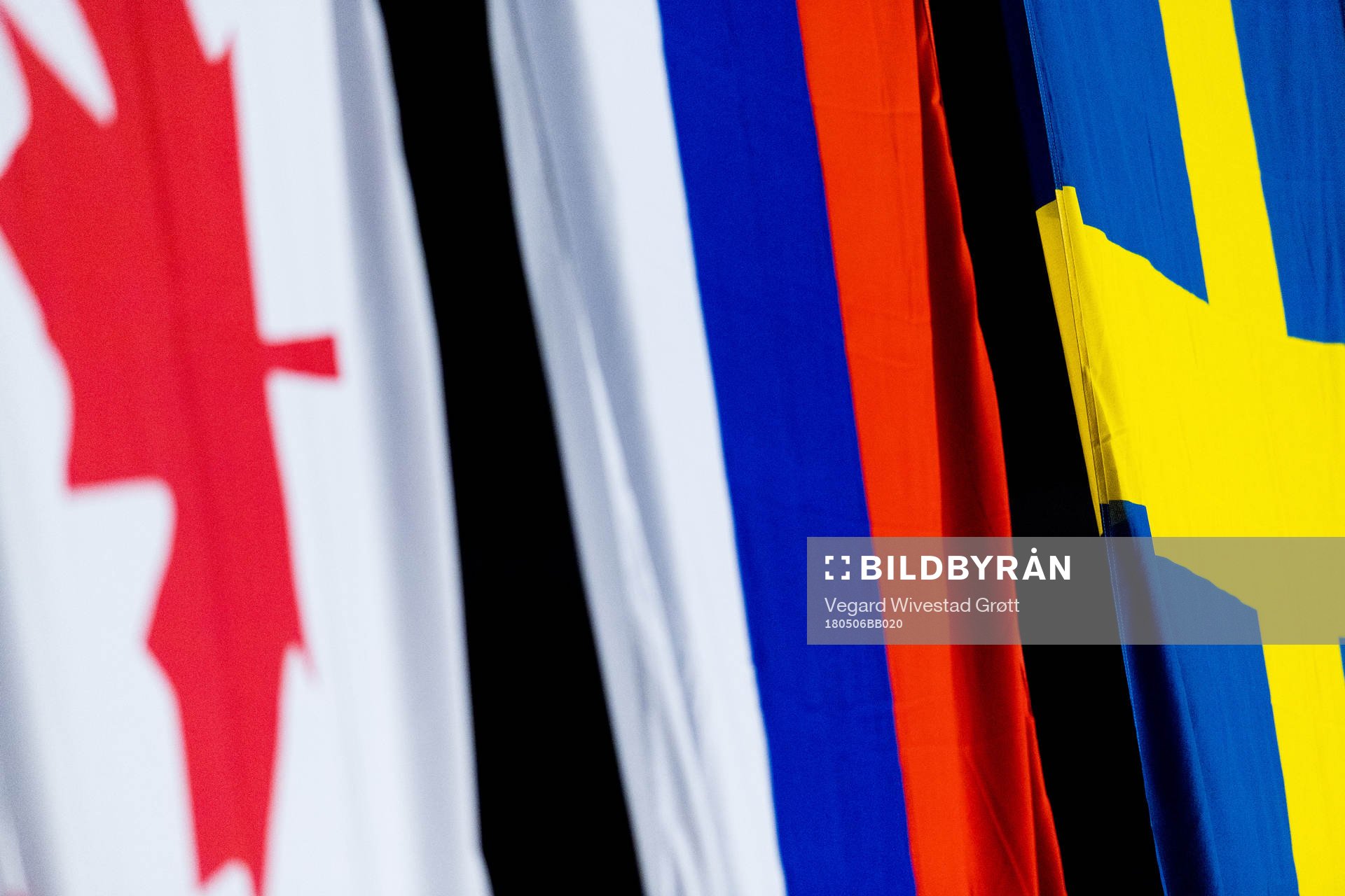 The flags of Canada, Russia and Sweden
