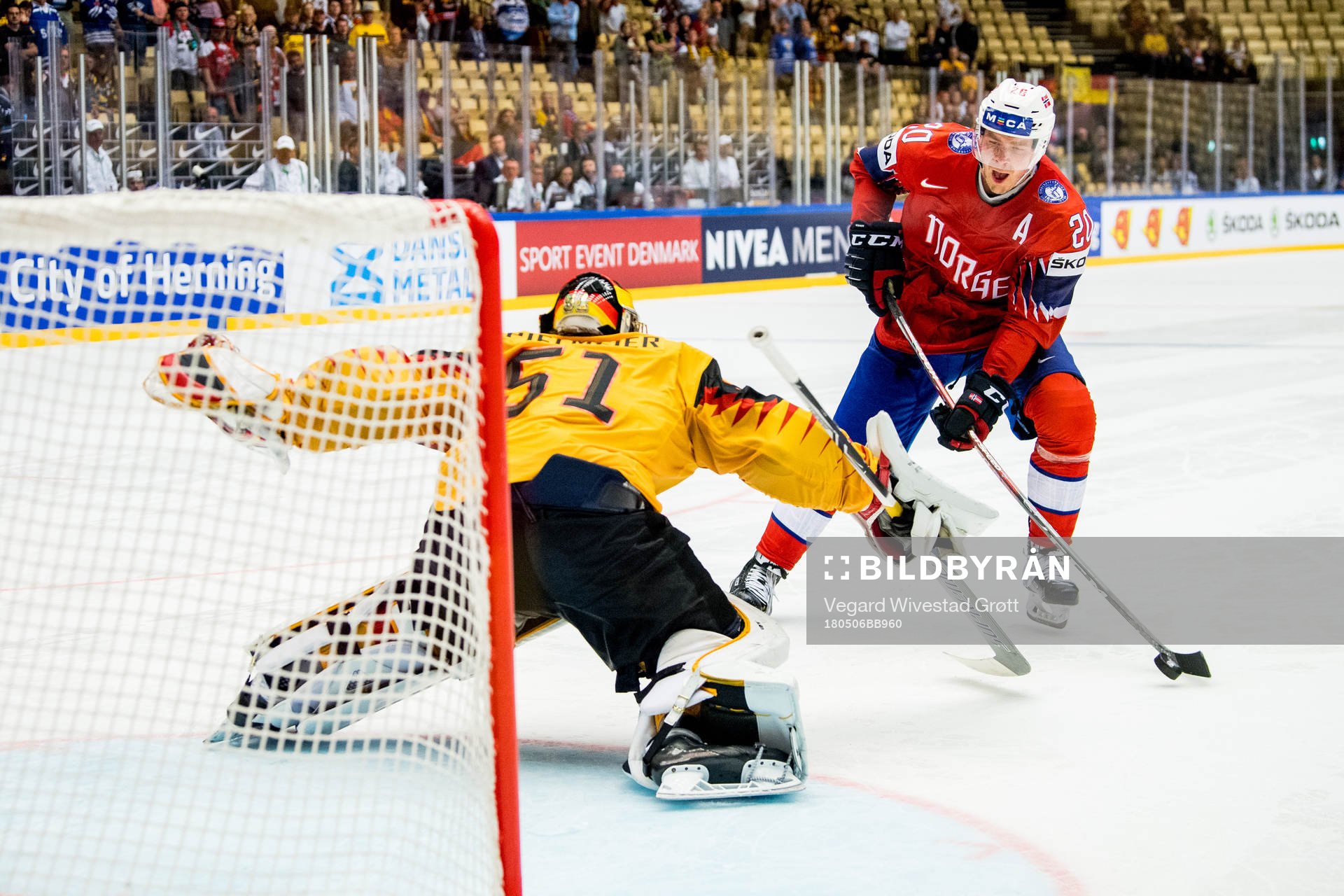Anders Bastiansen of Norway scores