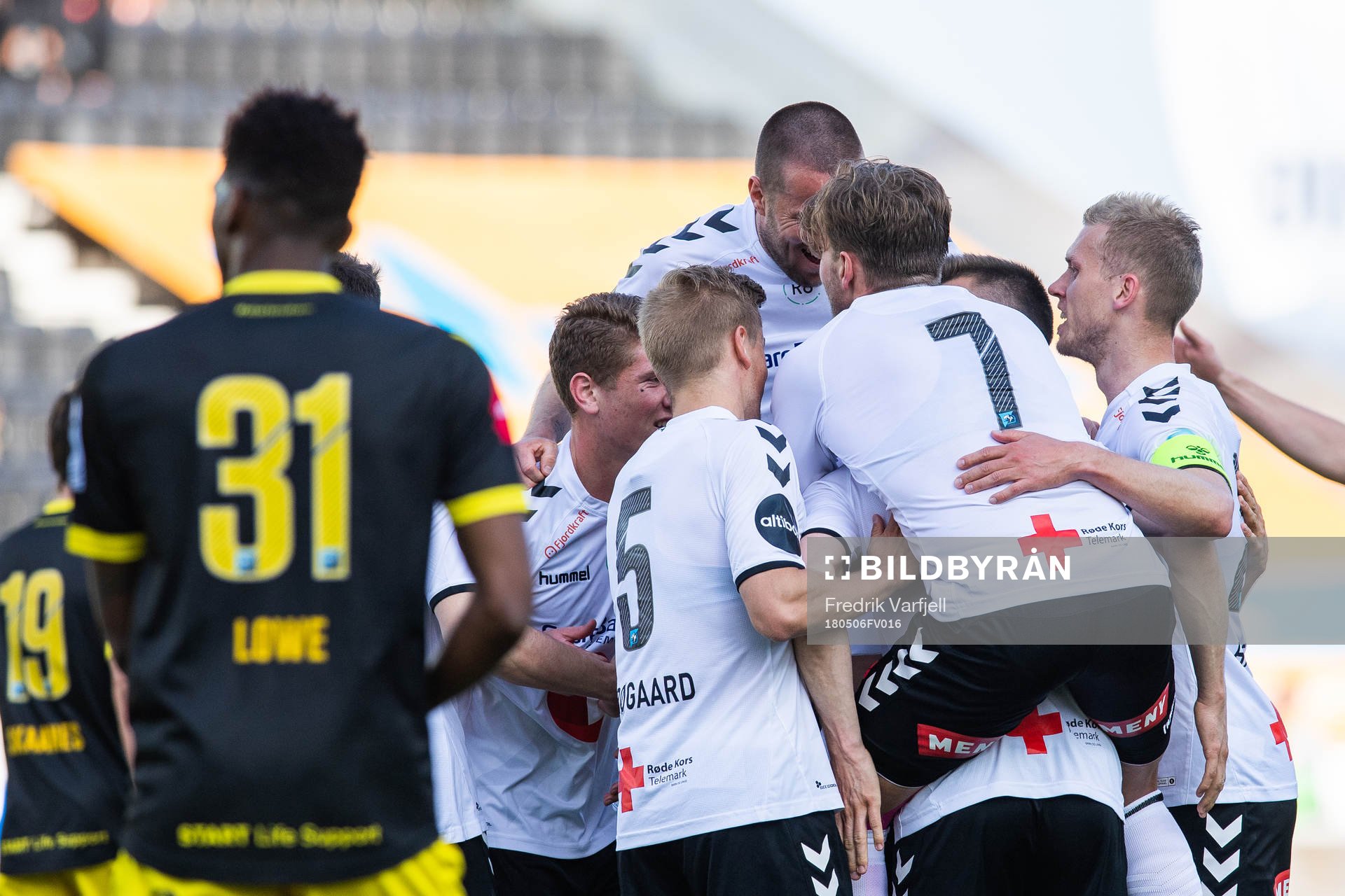 Fredrik Nordkvelle of Odd celebrate with team mates