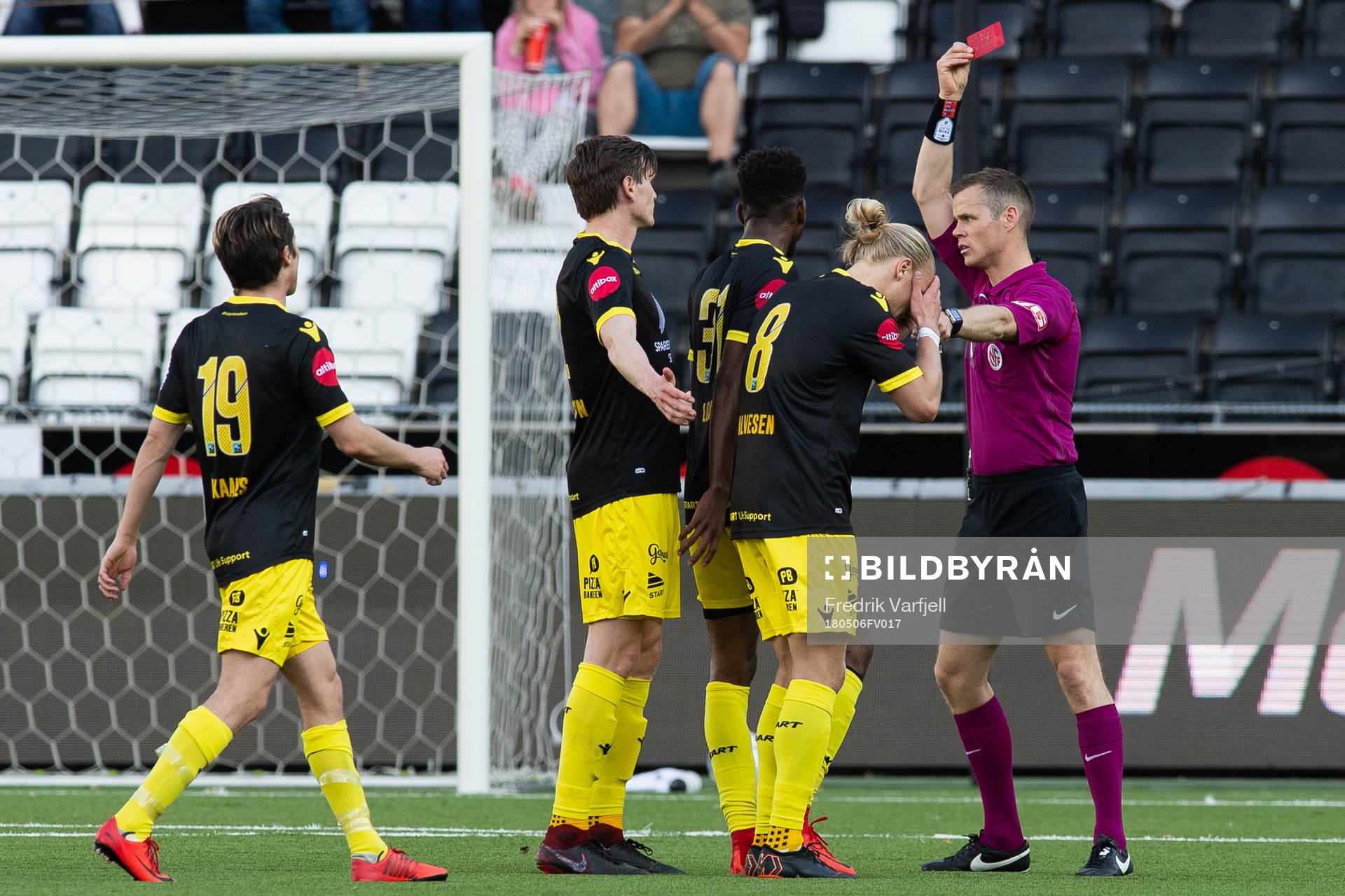 Lars-Jørgen Salvesen of Start is given a red card by Sigurd Smehus Kringstad, referee, during the Eliteserien match between Odd and Start on May 6, 2018 in Skien.