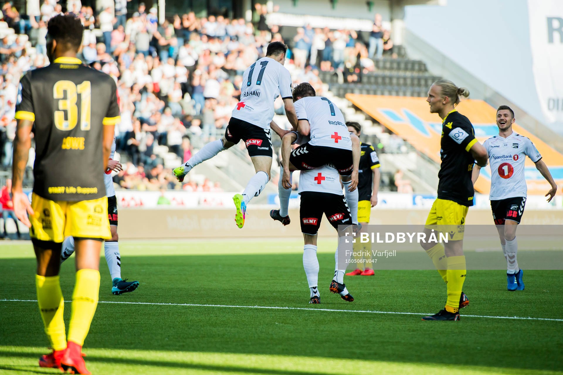 Fredrik Nordkvelle of Odd celebrates with his teammates after scoring 1-0 during the Eliteserien match between Odd and Start on May 6, 2018 in Skien.