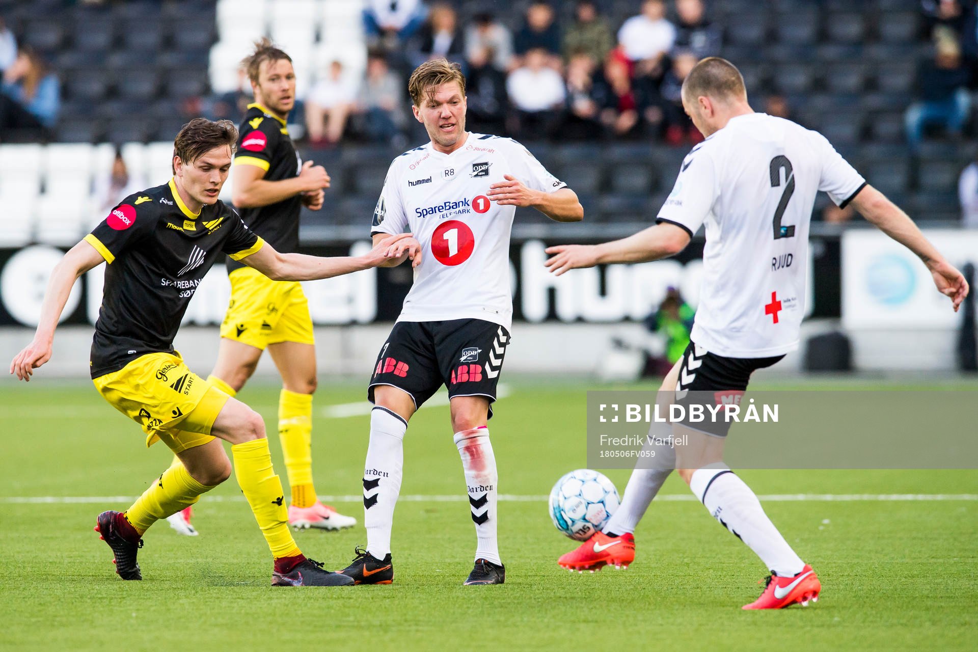 Kristjan Floki Finnbogason of Start, Erik Martin Broberg and Espen Ruud of Odd during the Eliteserien match between Odd and Start on May 6, 2018 in Skien.