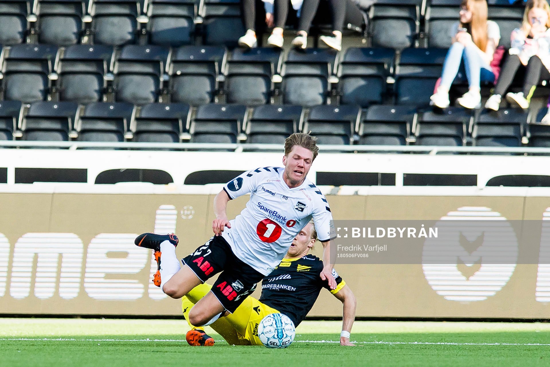 Lars-Jørgen Salvesen of Start tackle Erik Martin Broberg of Odd and gets a red card during the Eliteserien match between Odd and Start on May 6, 2018 in Skien.