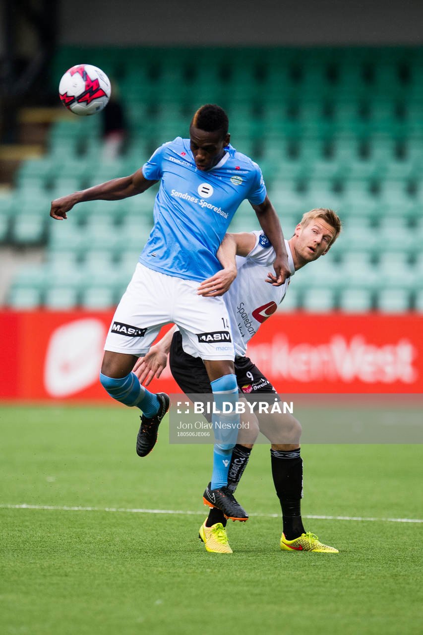 Akinsola Akinyemi of Sandnes Ulf and Ulrik Flo of Sogndal during the OBOS-ligaen match between Sogndal and Sandnes Ulf on May 6, 2018 in Sogndal.