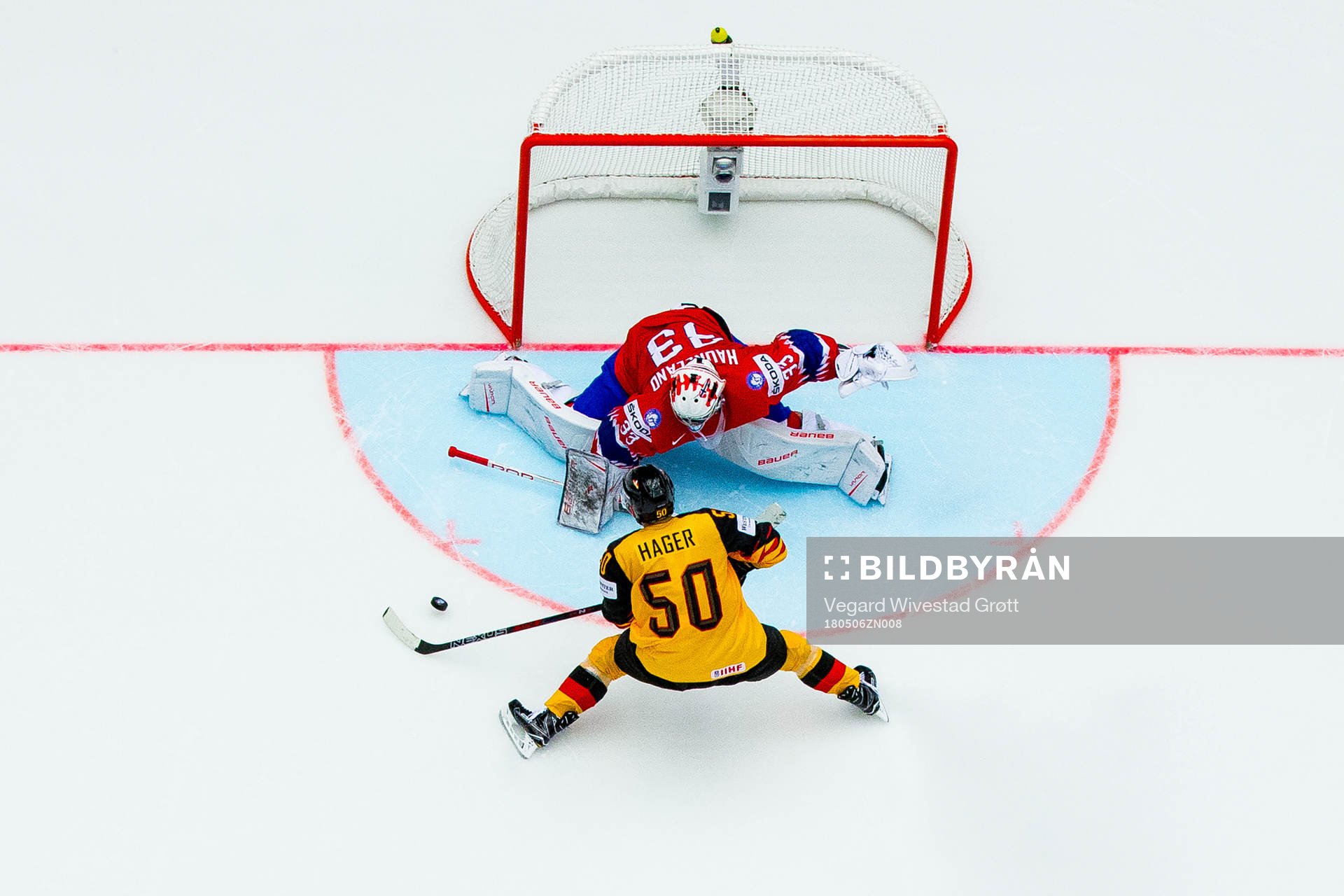 Goaltender Henrik Haukeland of Norway saves the penalty