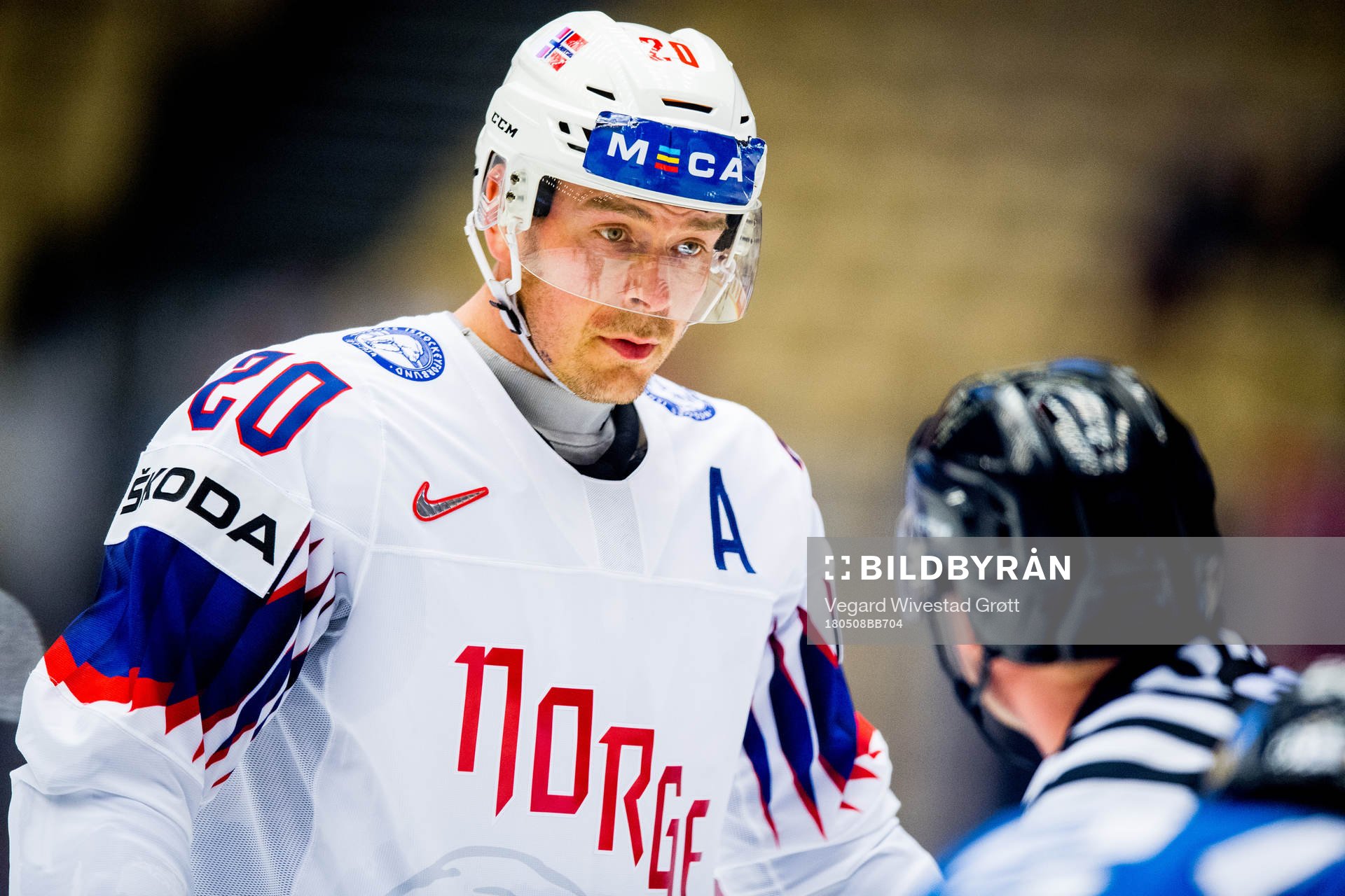 Anders Bastiansen of Norway talks to the referee