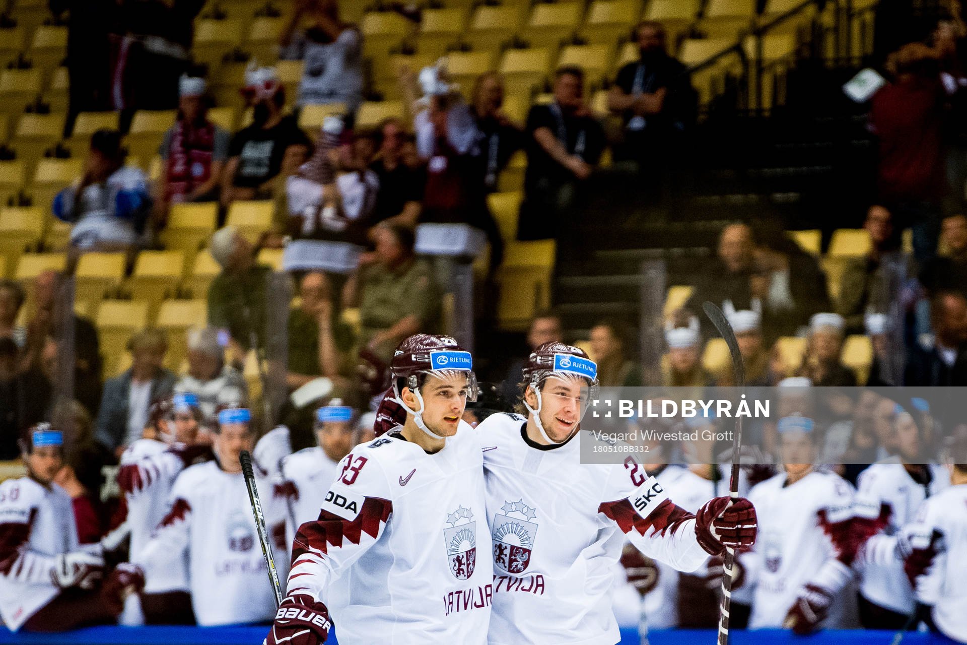 Uvis Janis Balinskis of Latvia celebrates with teammate