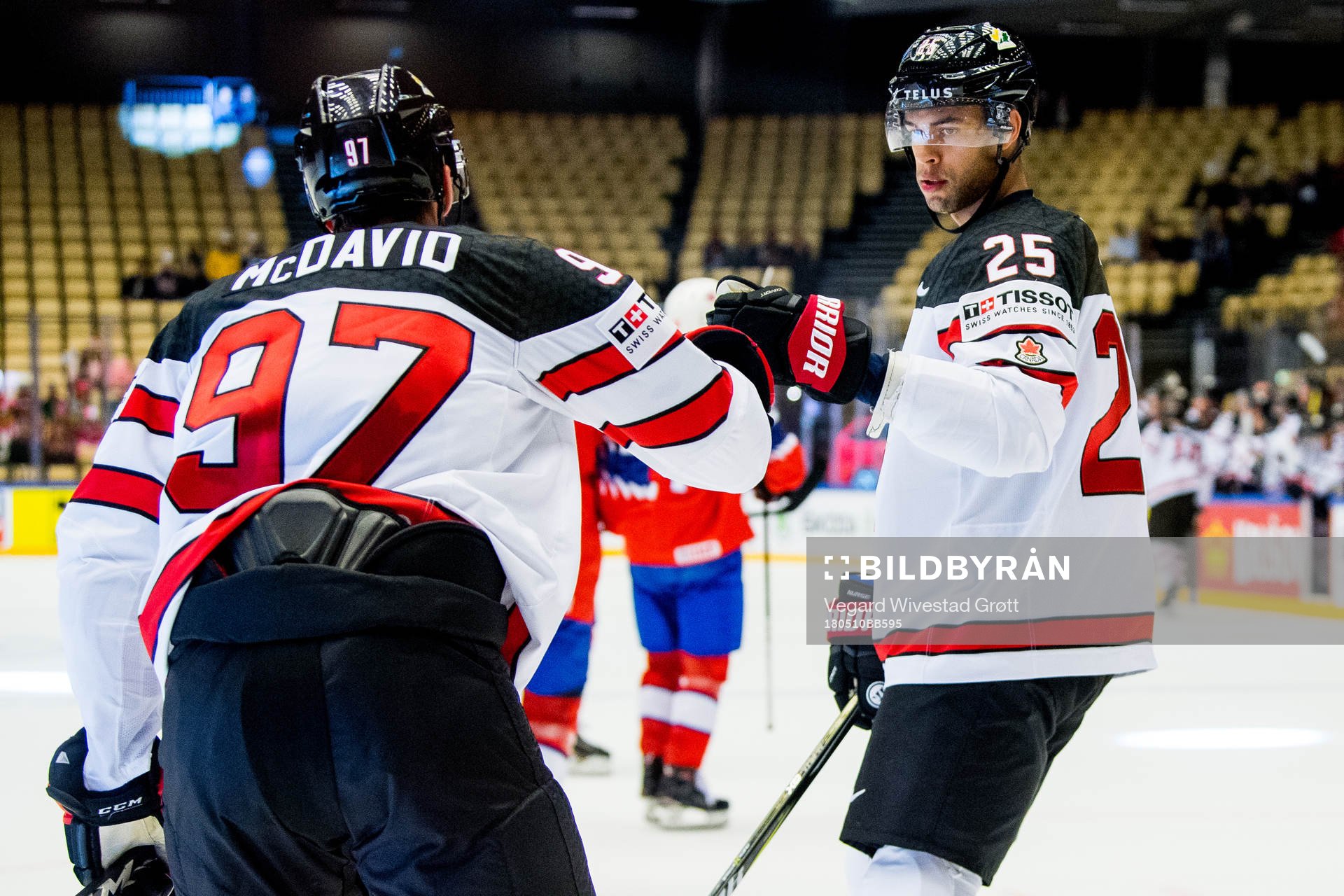 Connor McDavid of Canada celebrates with teammate Darnell