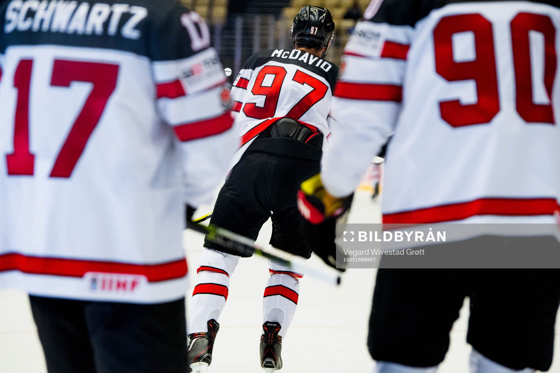 Connor McDavid of Canada celebrates with teammates Jaden