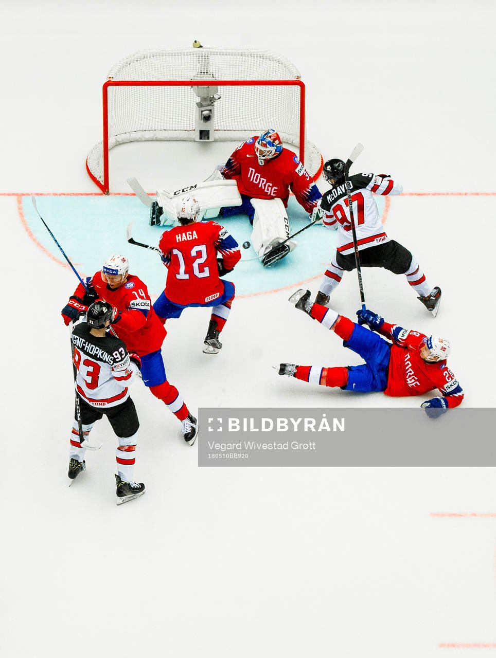 Connor McDavid of Canada scores 4-0 behind goaltender Lars