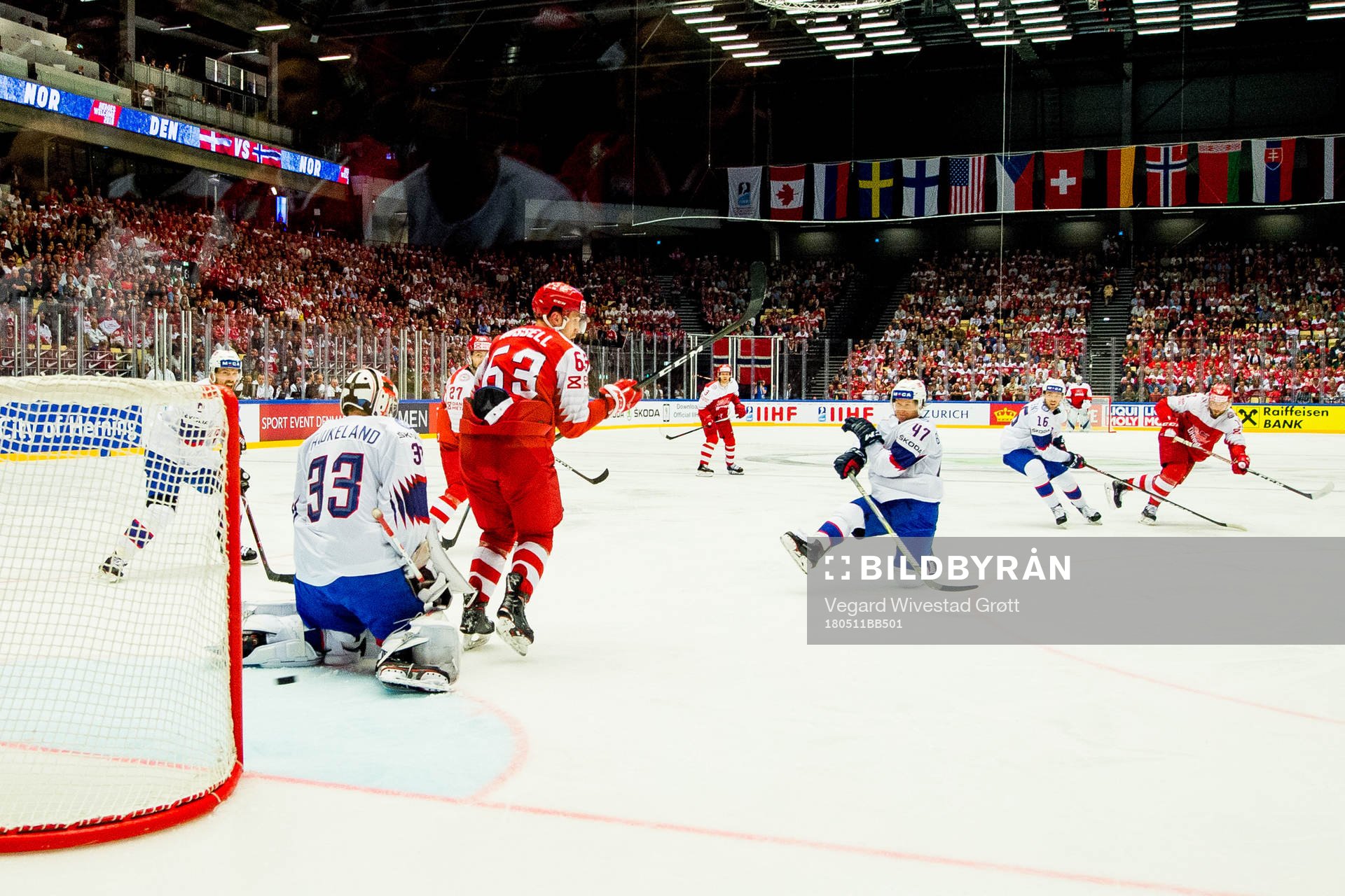 Nicklas Jensen of Denmark scores 2-0 behind goaltender