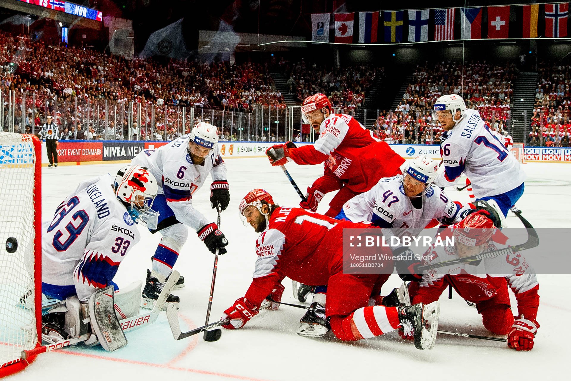 Goaltender Henrik Haukeland of Norway, Jonas Holøs of
